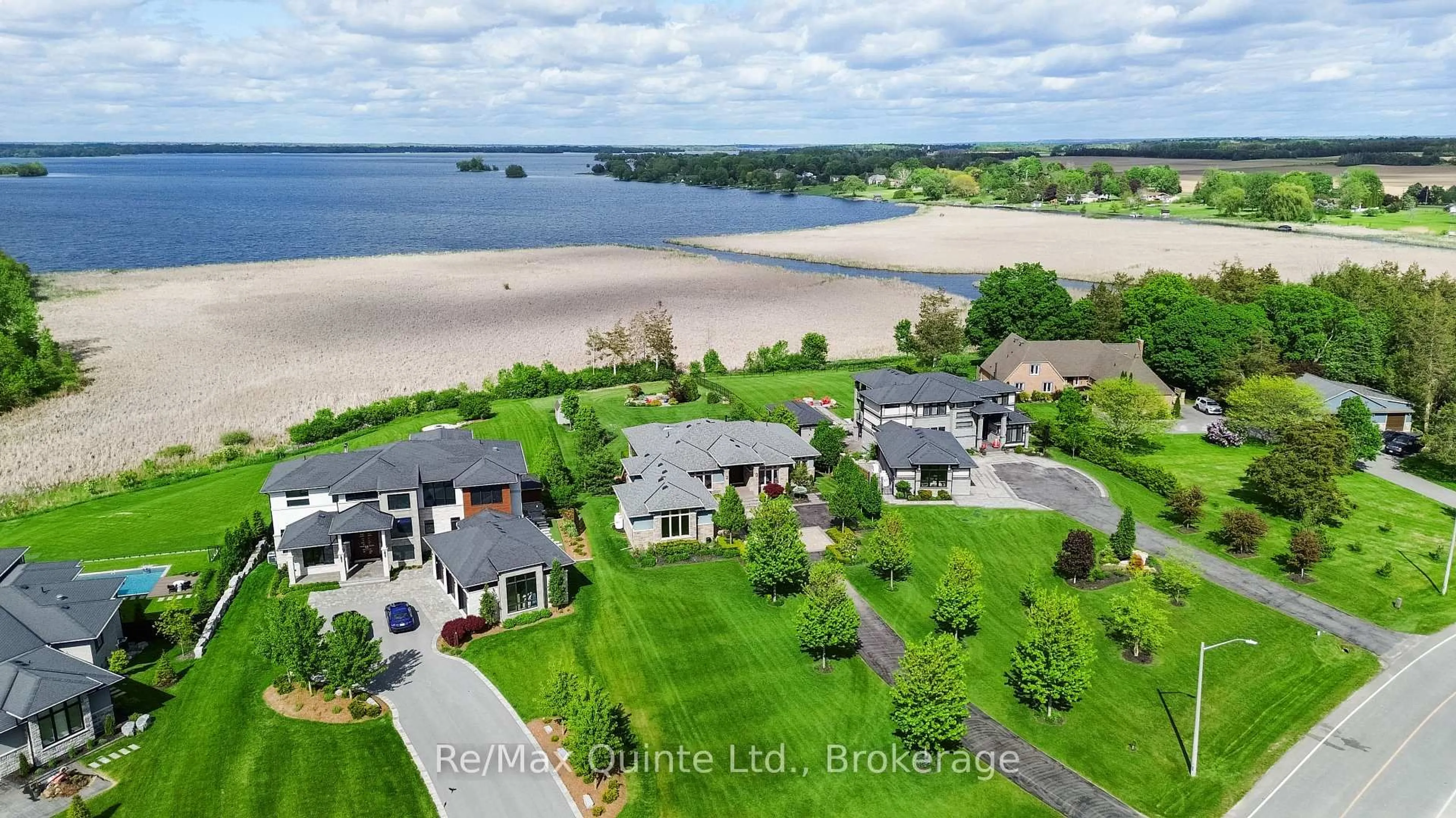 A pic from outside/outdoor area/front of a property/back of a property/a pic from drone, water/lake/river/ocean view for 89 Navigation Dr, Prince Edward County Ontario K8N 0G1
