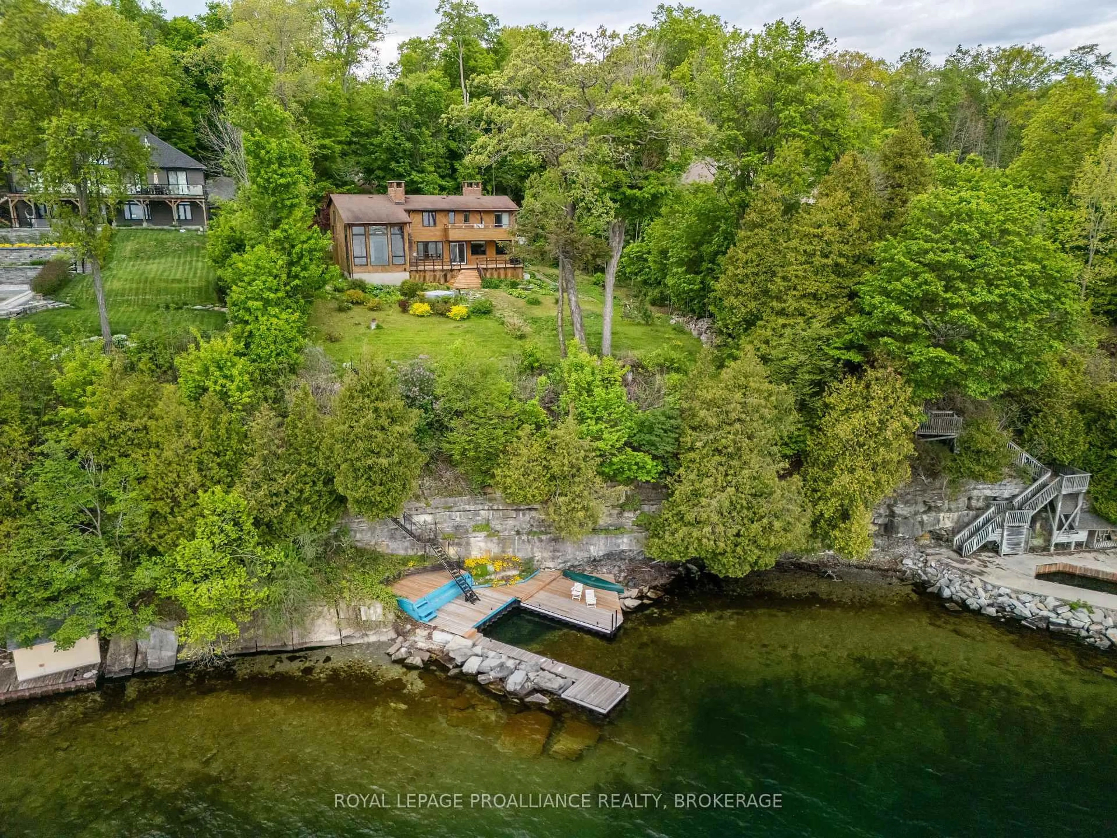 A pic from outside/outdoor area/front of a property/back of a property/a pic from drone, water/lake/river/ocean view for 20 Riverside Dr, Kingston Ontario K7L 4V1