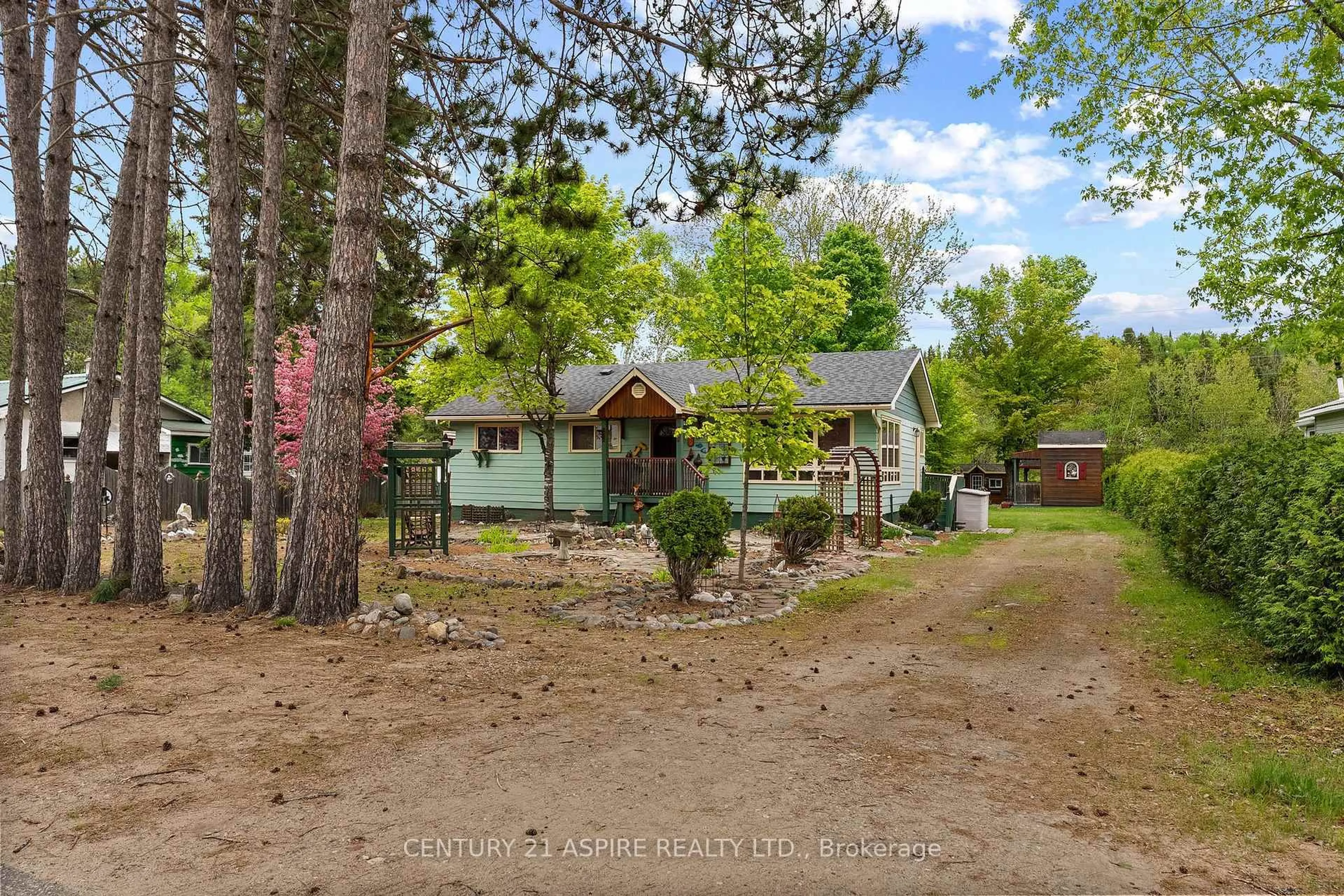 A pic from outside/outdoor area/front of a property/back of a property/a pic from drone, forest/trees view for 37 Mill St, South Algonquin Ontario K0J 2M0
