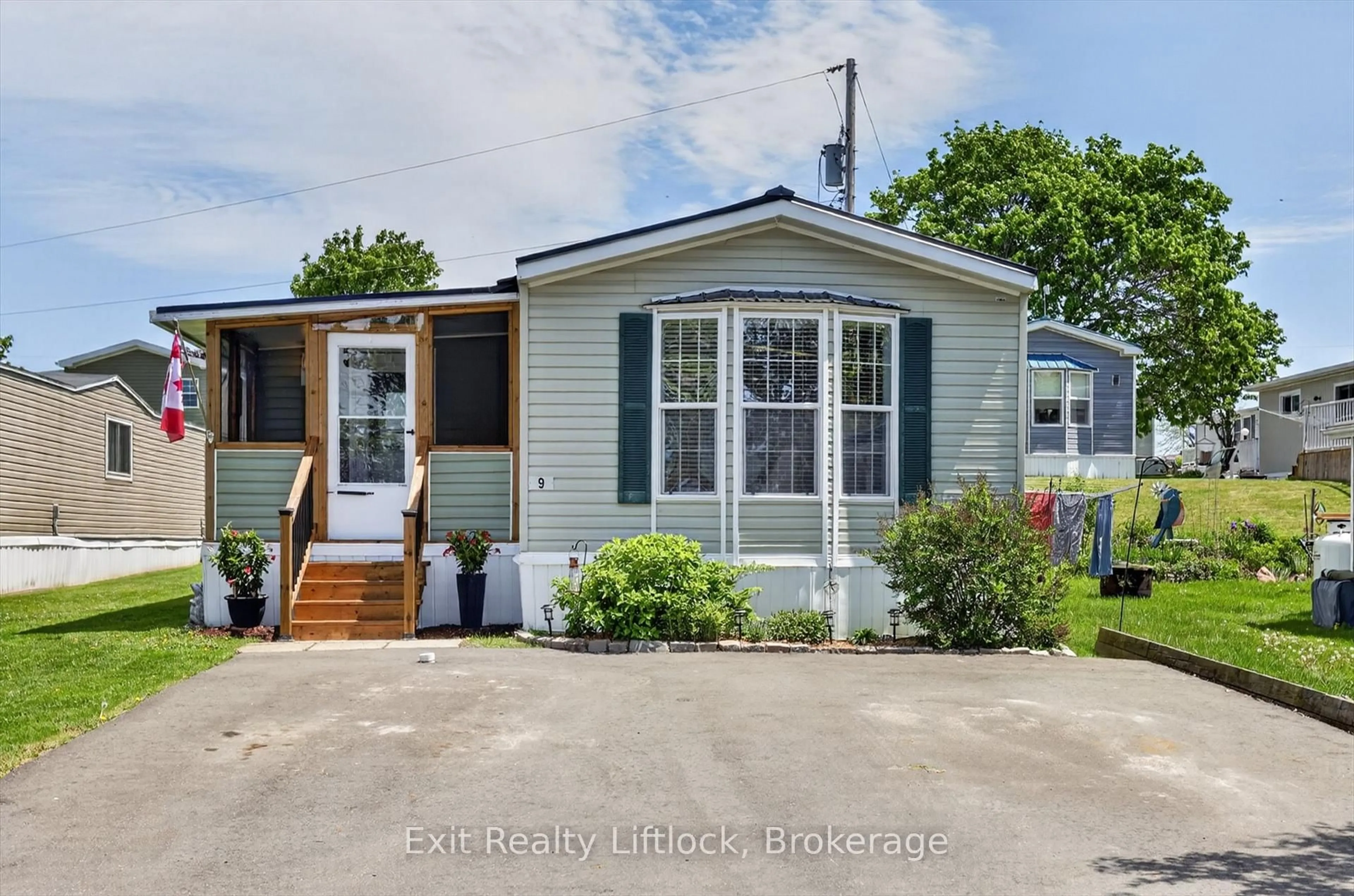 Home with vinyl exterior material, street for 9 Poplar Dr, Otonabee-South Monaghan Ontario K0L 2G0