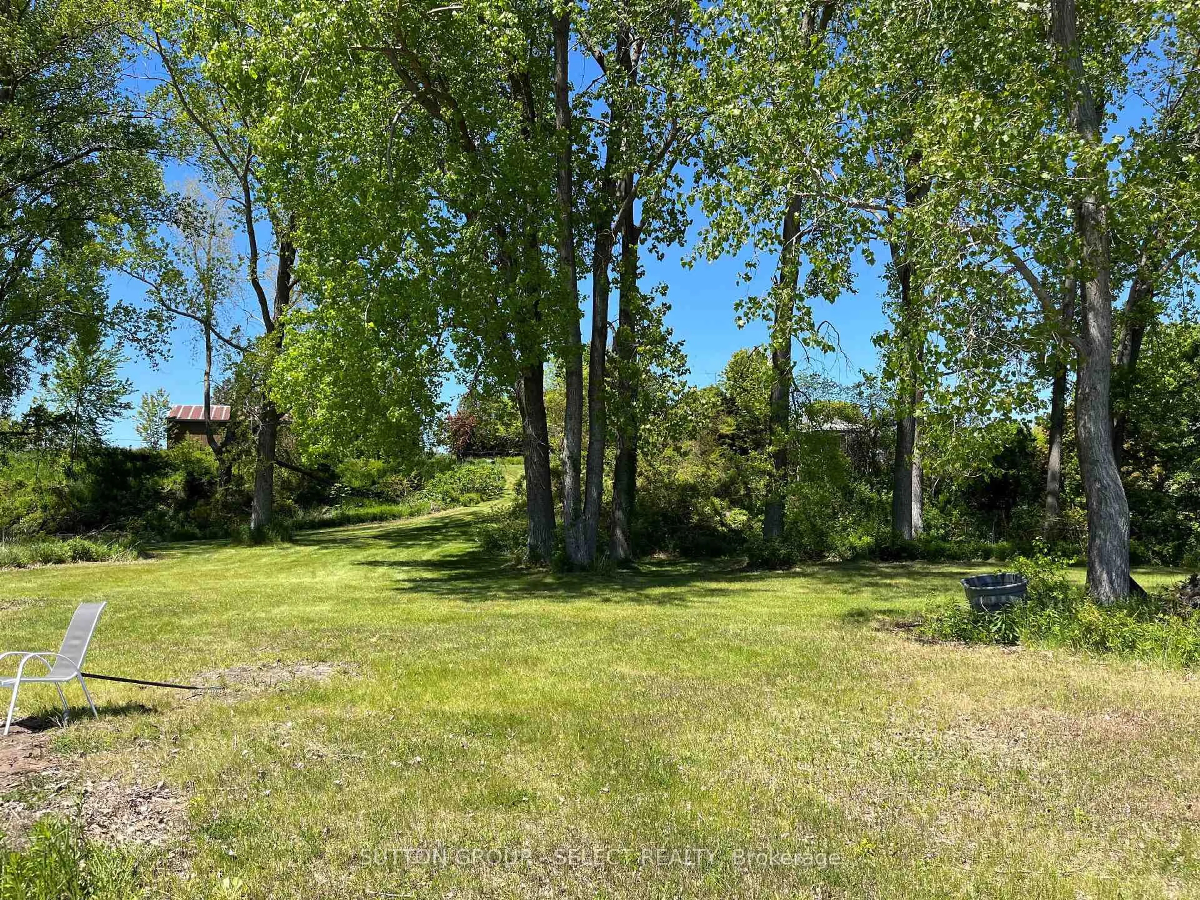 A pic from outside/outdoor area/front of a property/back of a property/a pic from drone, forest/trees view for 7504 Talbot Tr, Chatham-Kent Ontario N0P 1A0