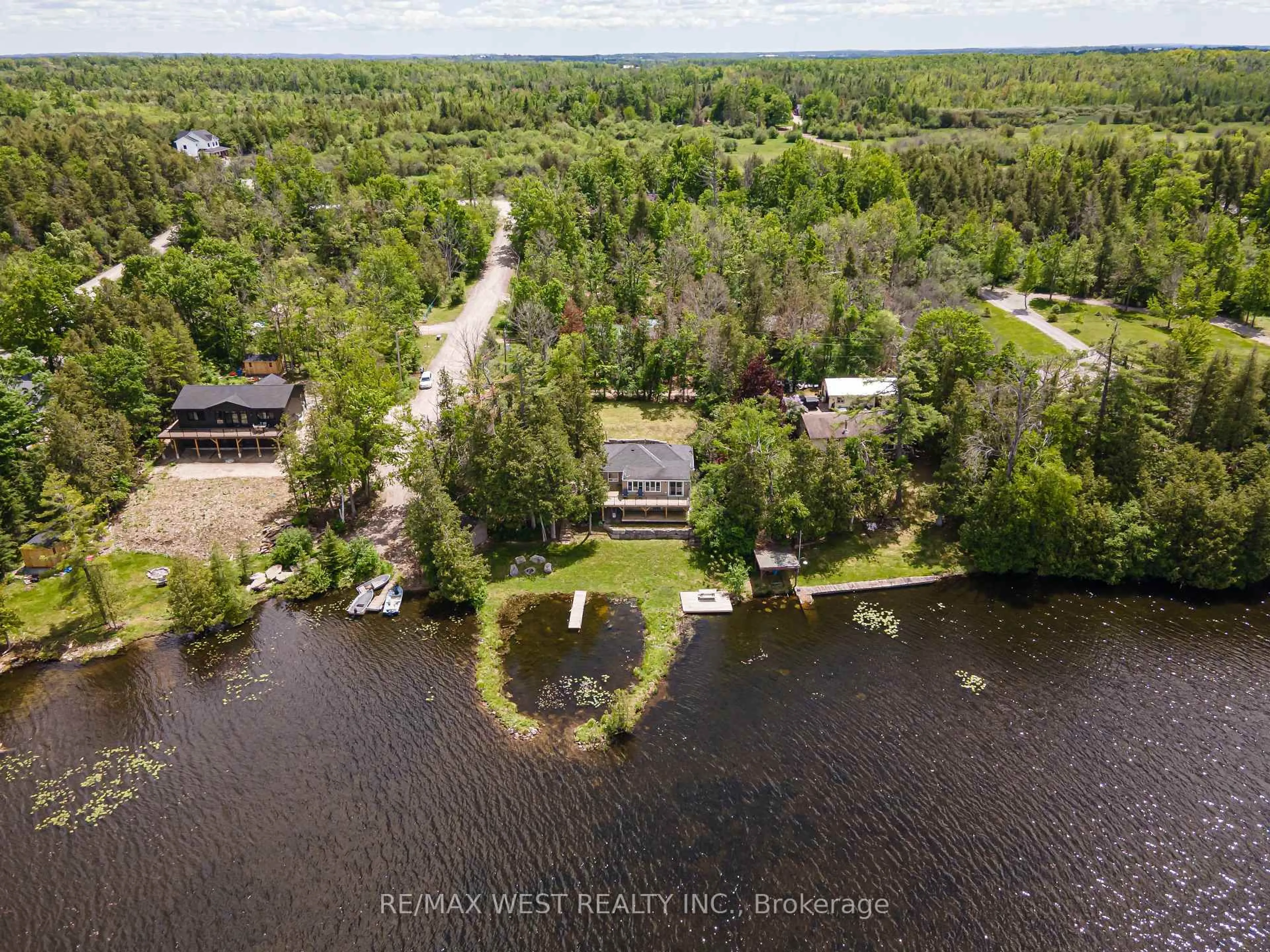 A pic from outside/outdoor area/front of a property/back of a property/a pic from drone, water/lake/river/ocean view for 15 Manchester Tr, Kawartha Lakes Ontario K0M 1A0