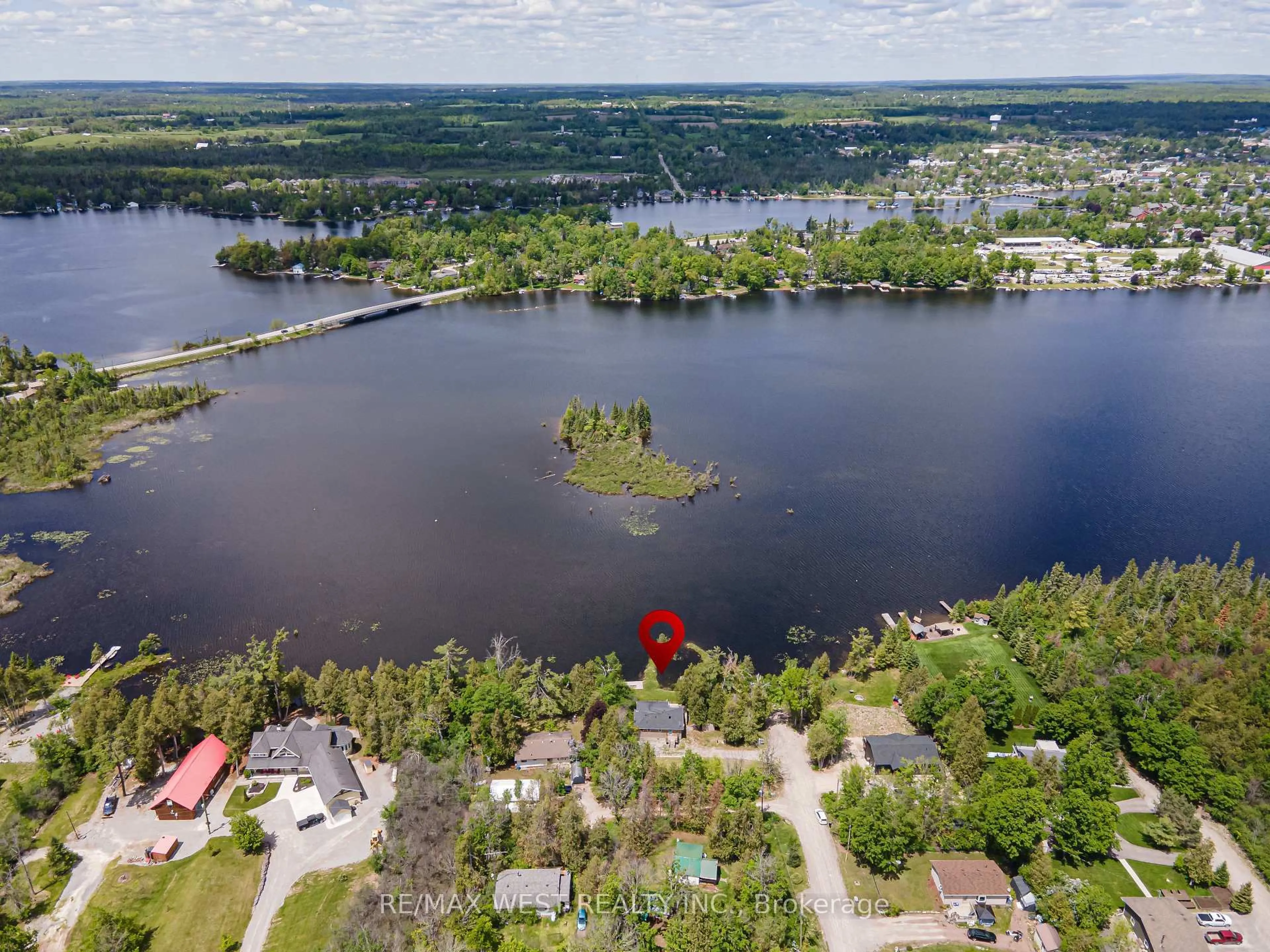 A pic from outside/outdoor area/front of a property/back of a property/a pic from drone, water/lake/river/ocean view for 15 Manchester Tr, Kawartha Lakes Ontario K0M 1A0