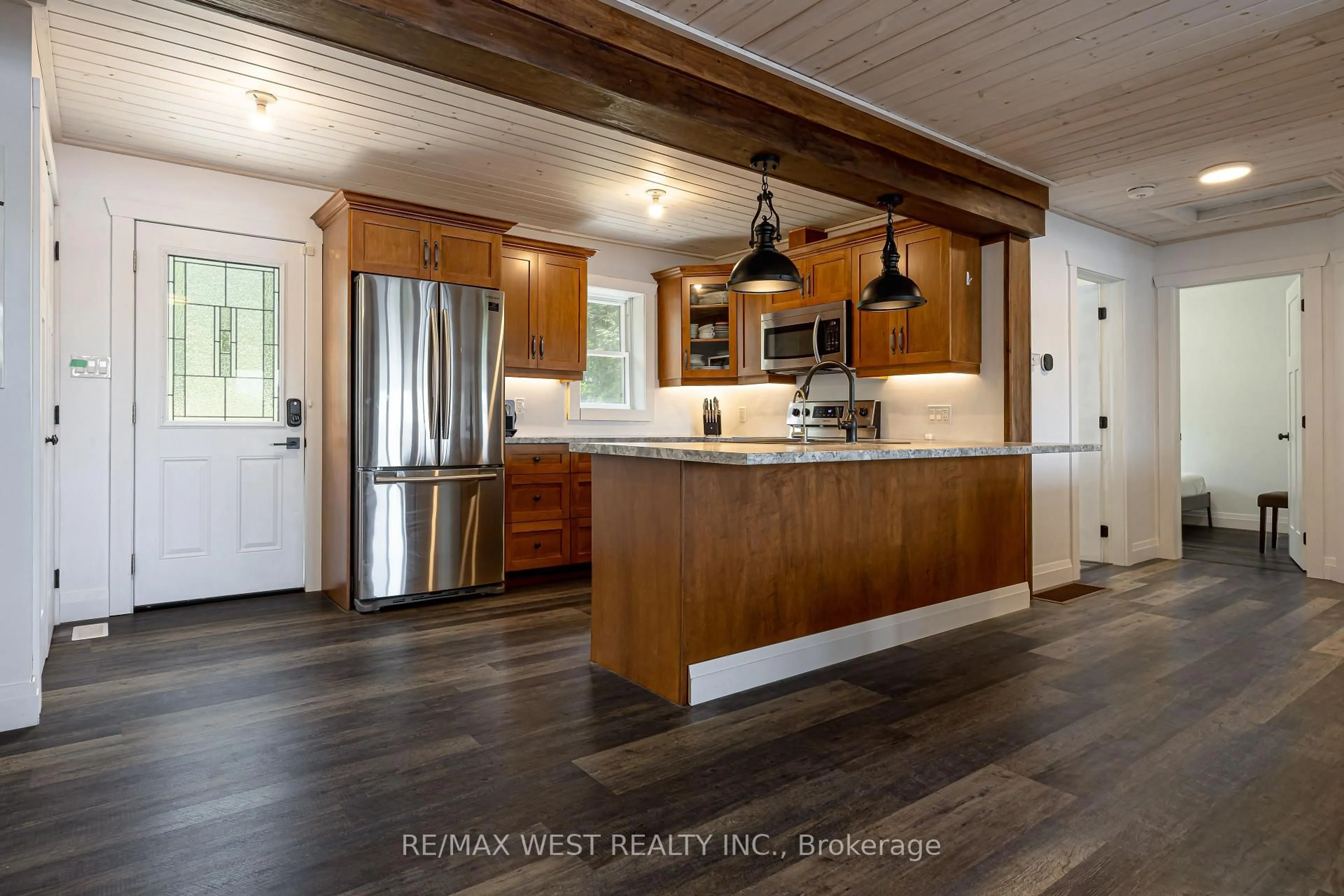 Open concept kitchen, wood/laminate floor for 15 Manchester Tr, Kawartha Lakes Ontario K0M 1A0