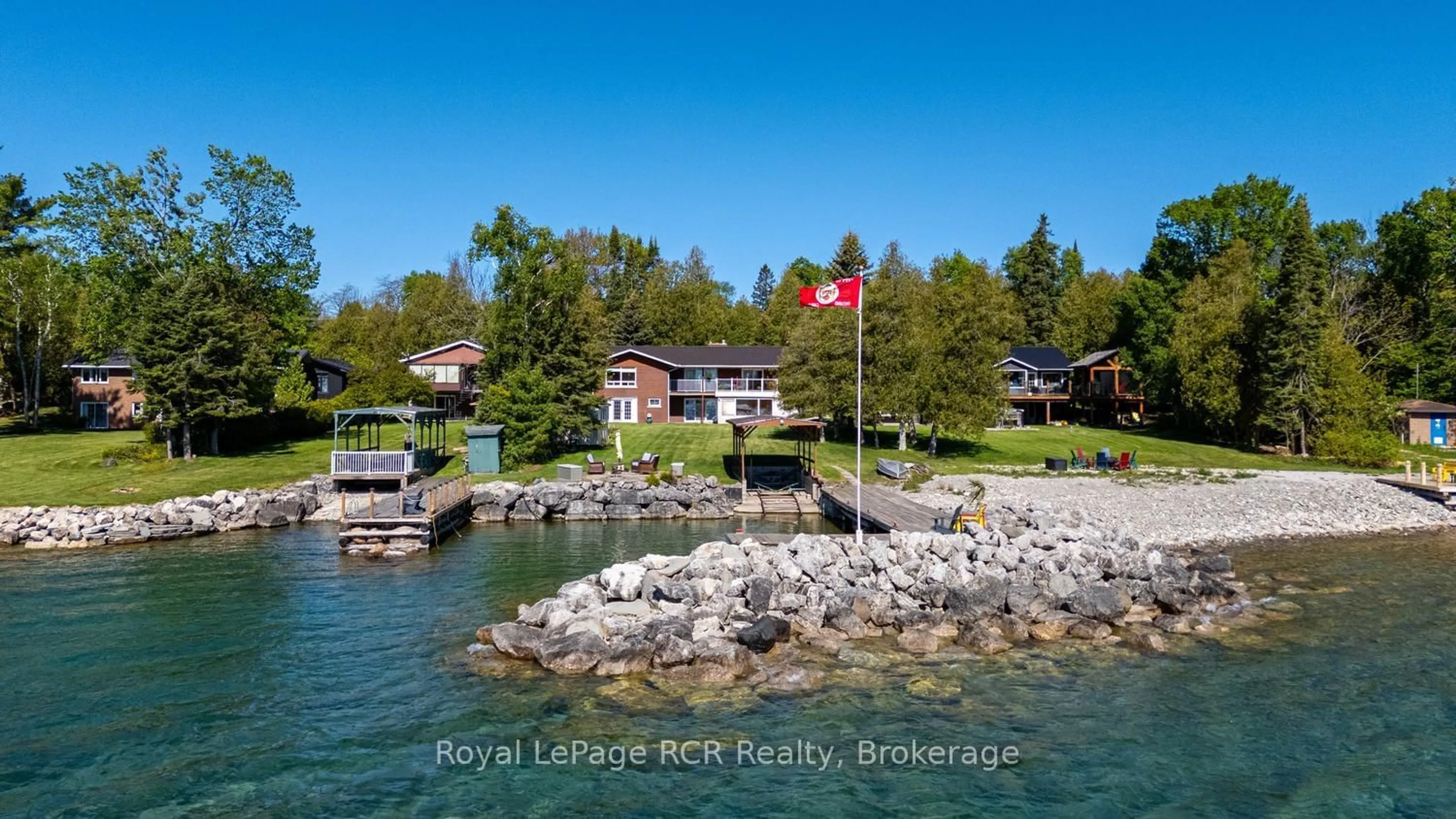 A pic from outside/outdoor area/front of a property/back of a property/a pic from drone, water/lake/river/ocean view for 405 Balmy Beach Rd, Georgian Bluffs Ontario N4K 5N4