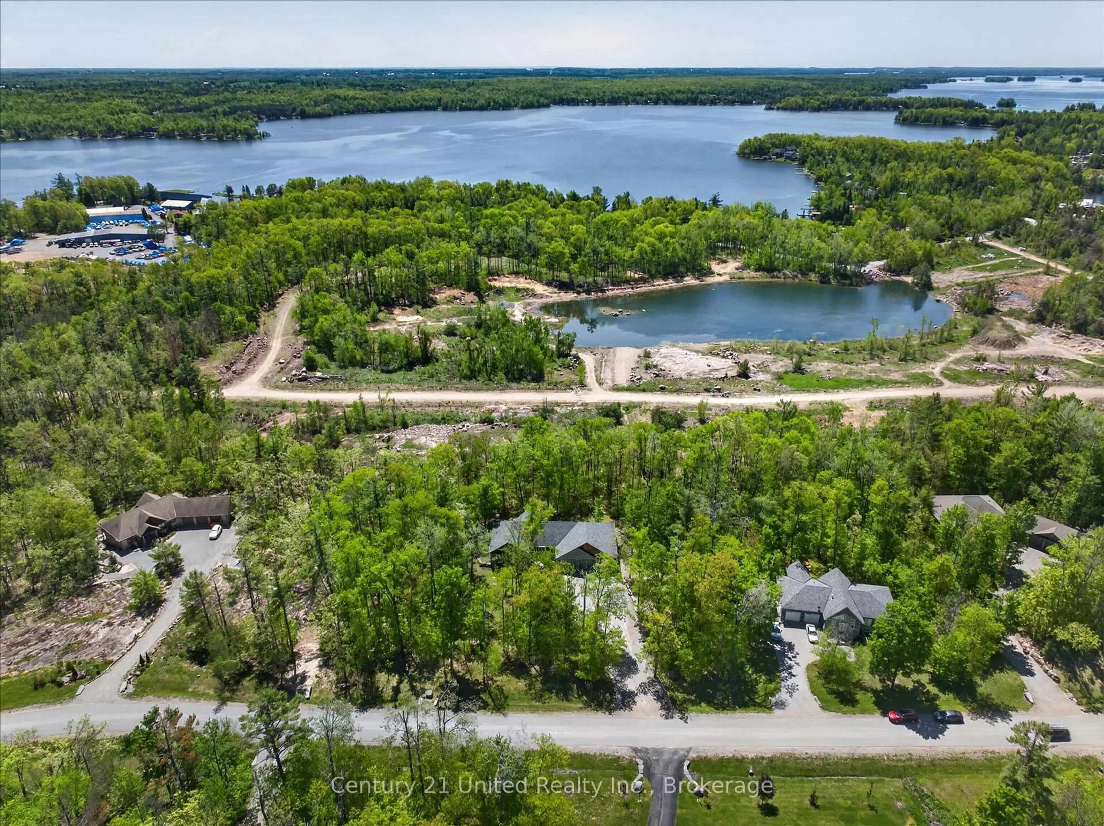 A pic from outside/outdoor area/front of a property/back of a property/a pic from drone, water/lake/river/ocean view for 54 Mitchell Cres, Trent Lakes Ontario K0L 1J0