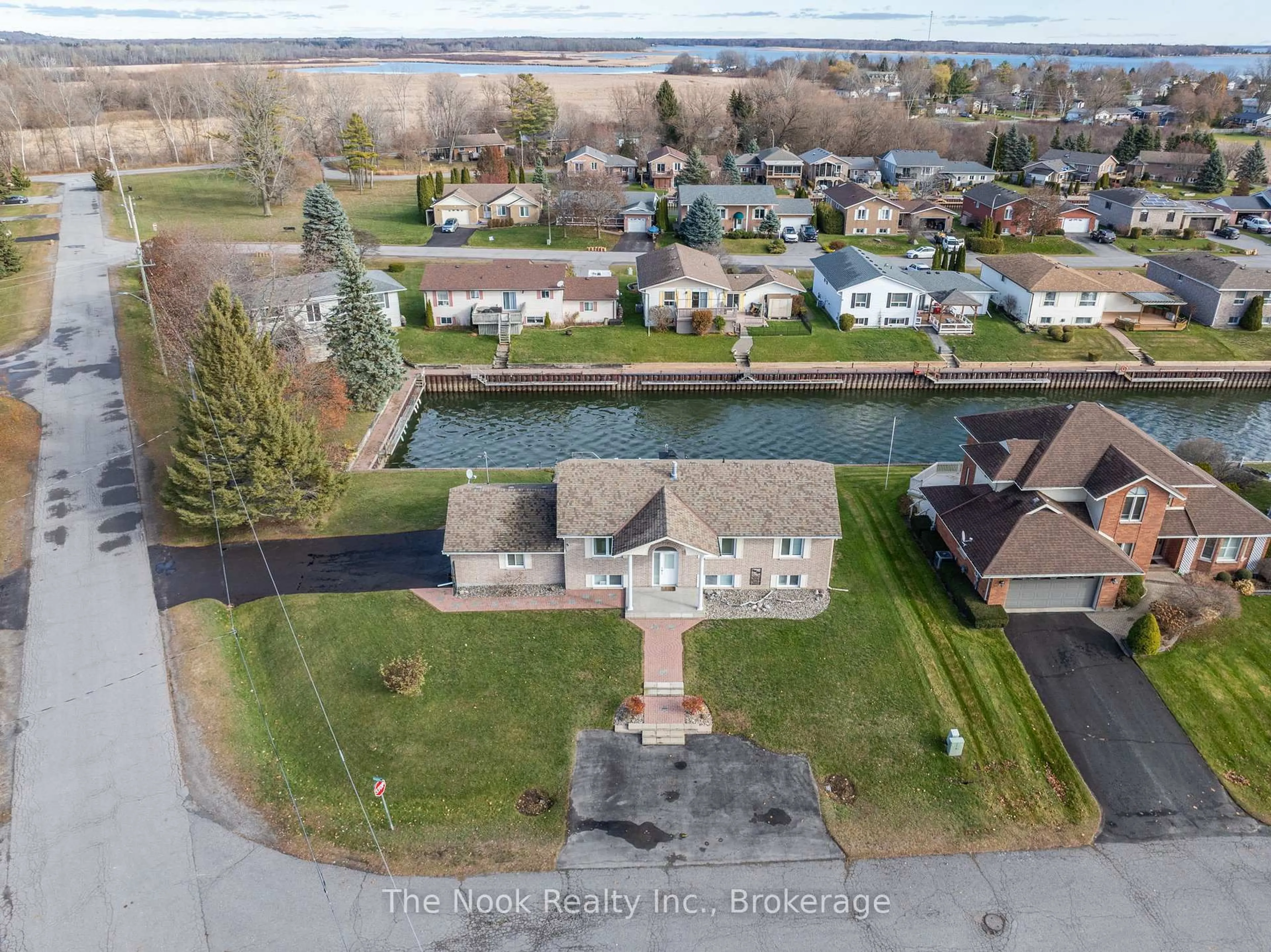 A pic from outside/outdoor area/front of a property/back of a property/a pic from drone, water/lake/river/ocean view for 12 Rogers Rd, Brighton Ontario K0K 1H0