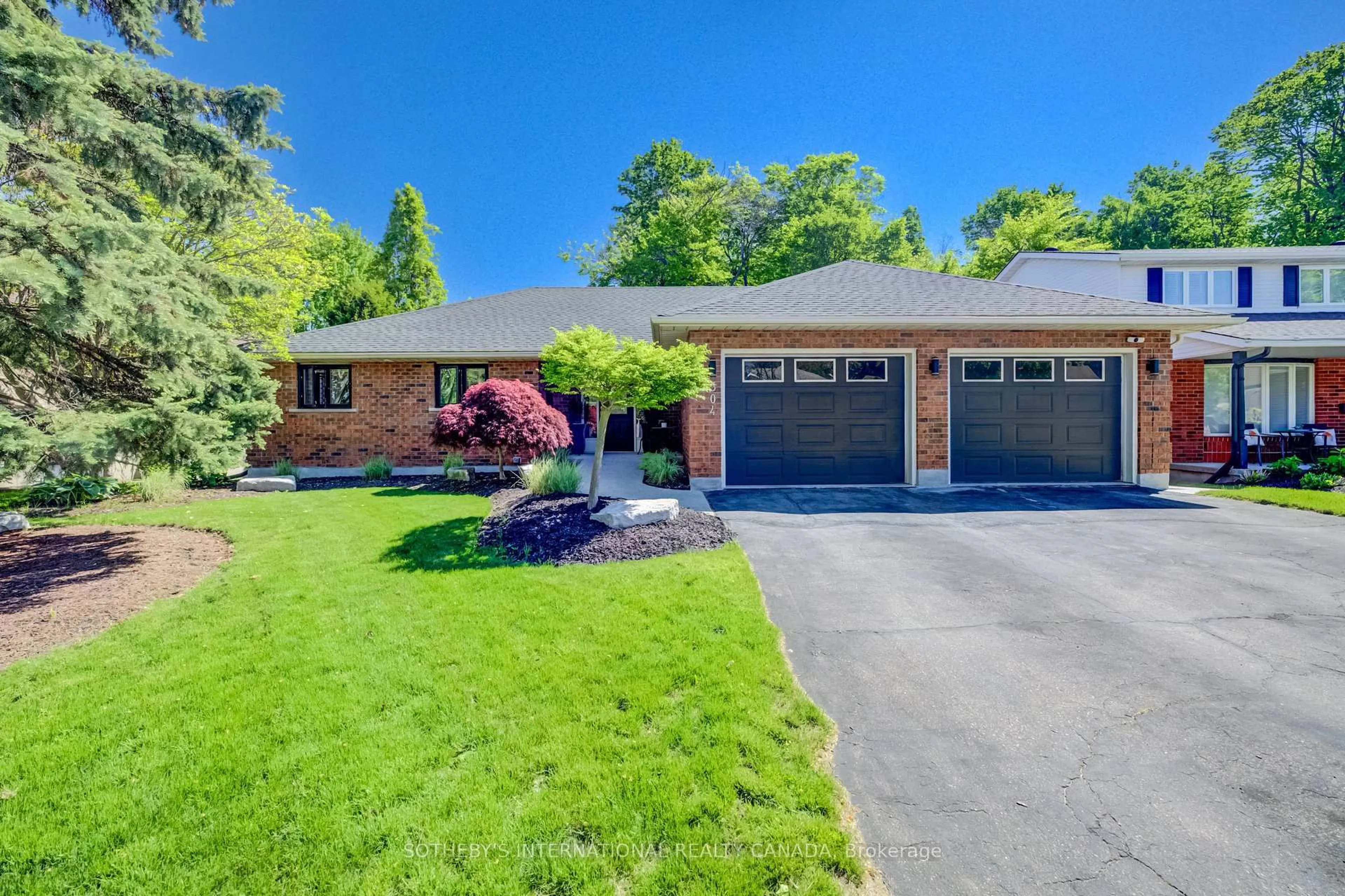 Home with brick exterior material, street for 304 Auburn Dr, Waterloo Ontario N2K 3K5
