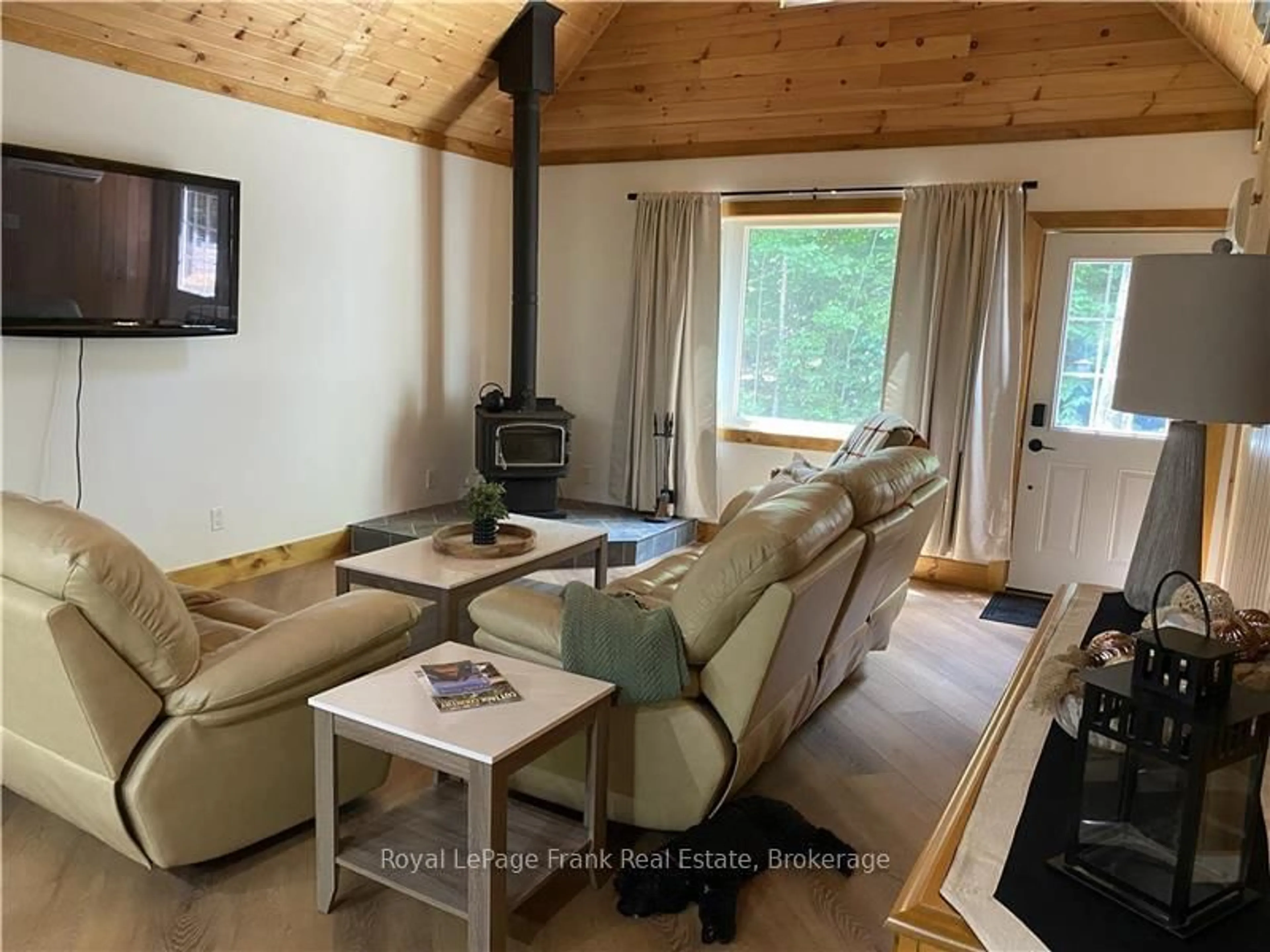 Living room with furniture, wood/laminate floor for 595 Old Diamond Lake Rd, Bancroft Ontario K0L 1C0
