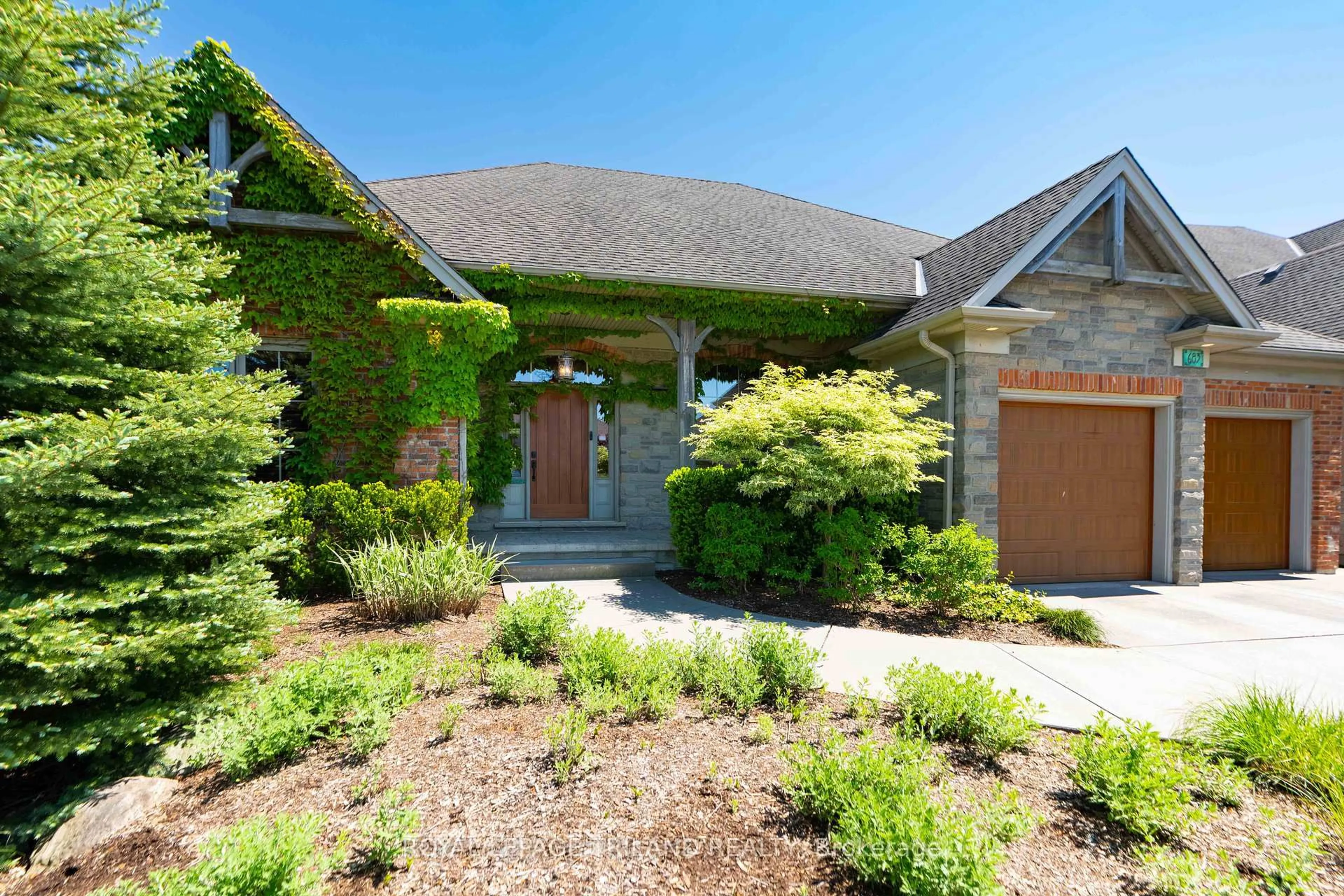 Home with brick exterior material, street for 683 EAGLETRACE Dr, London North Ontario N6G 0E8