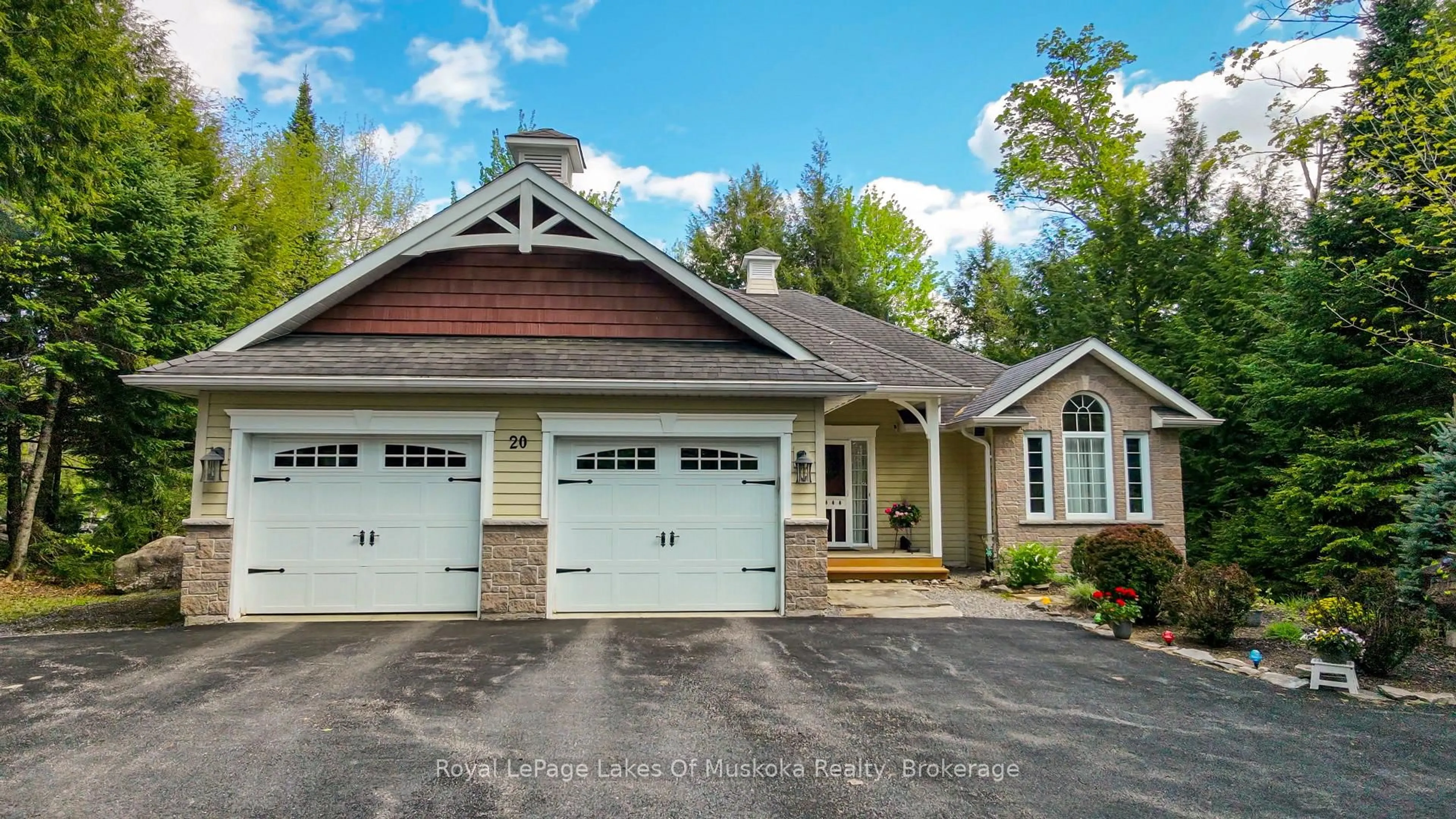 Home with vinyl exterior material, street for 20 Deerhurst Highlands Dr, Huntsville Ontario P1H 1B1