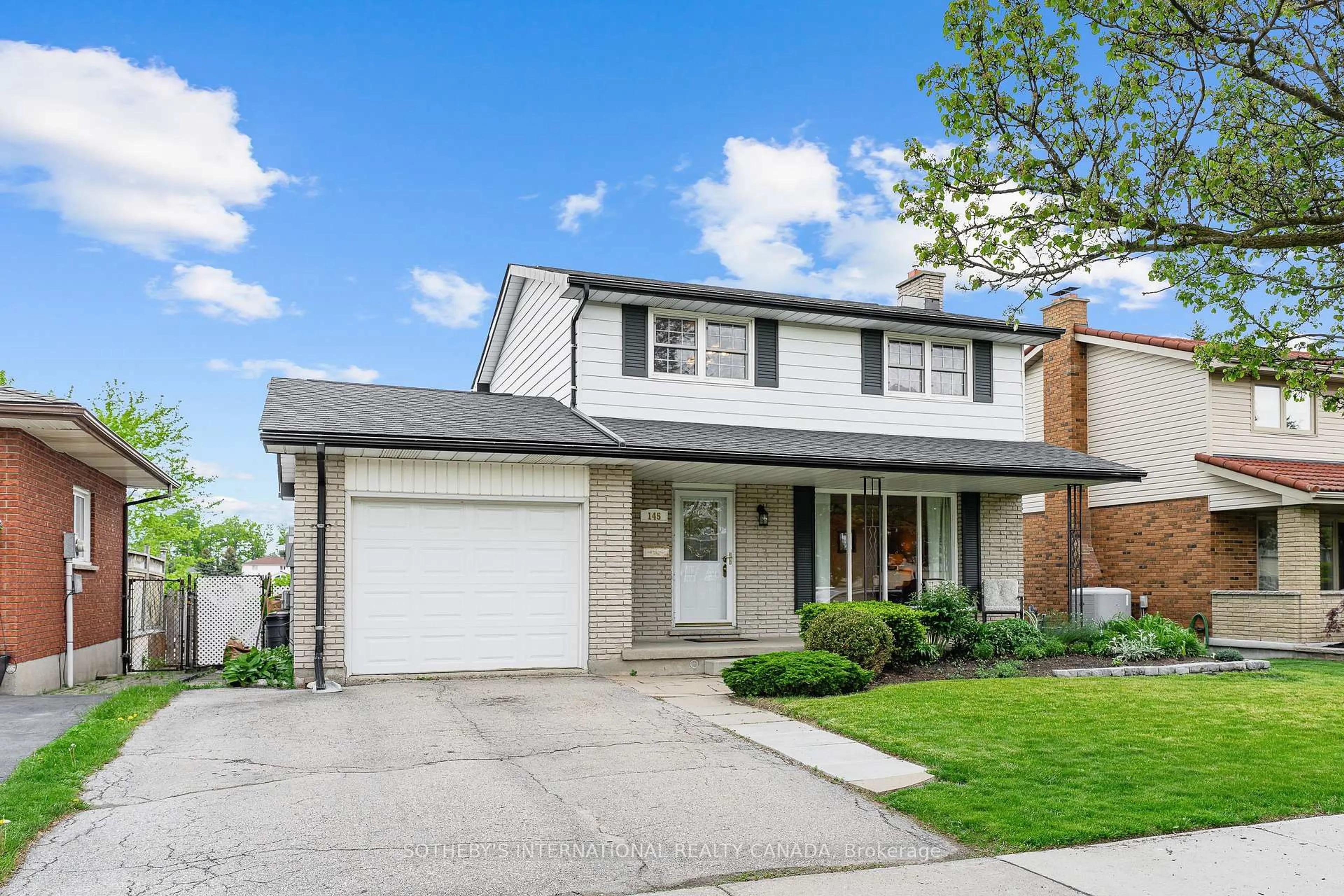 Home with vinyl exterior material, street for 145 Westchester Dr, Kitchener Ontario N2B 3L6