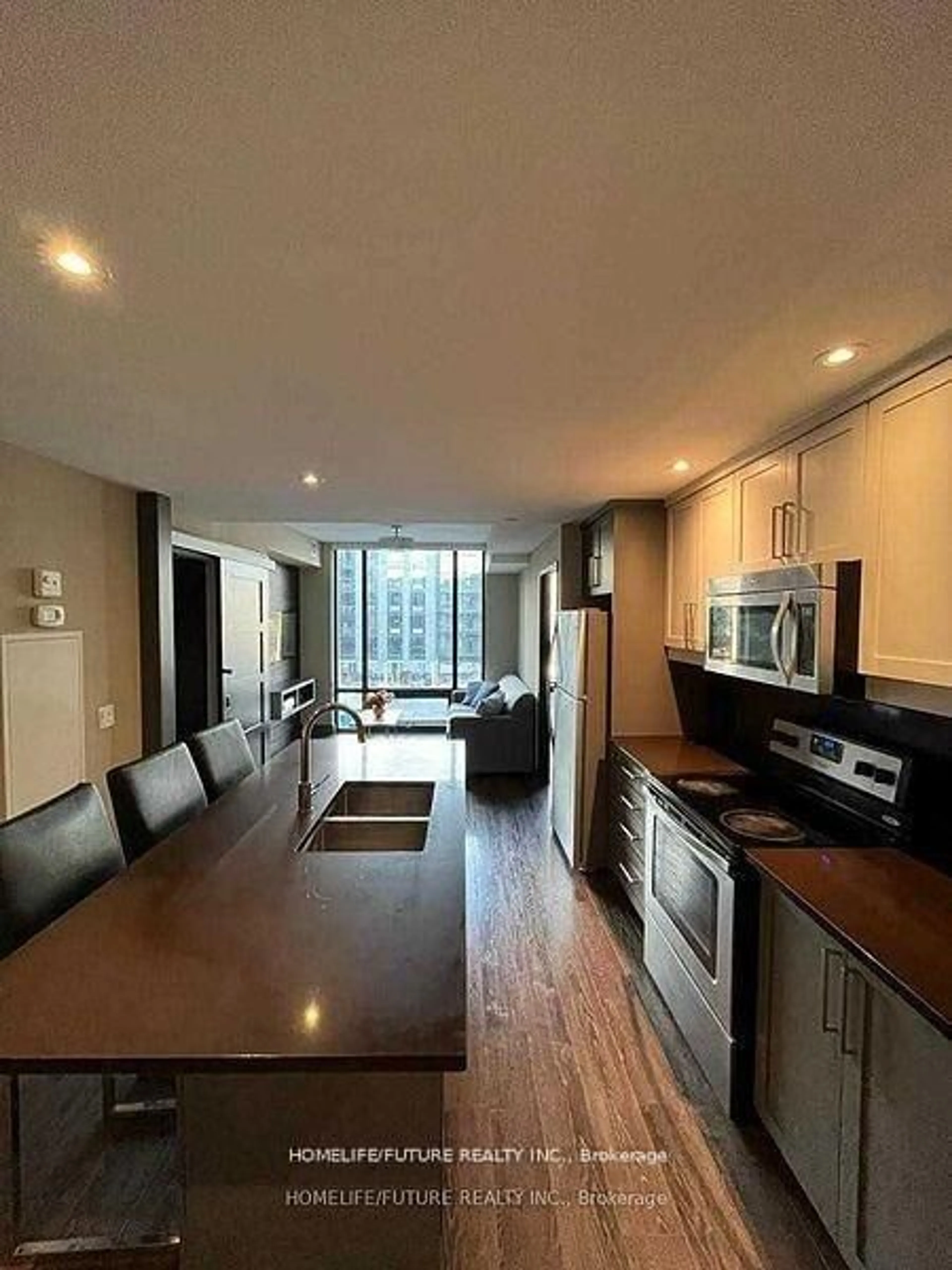 Open concept kitchen, wood/laminate floor for 330 Phillip St #C523, Waterloo Ontario N2L 3W9