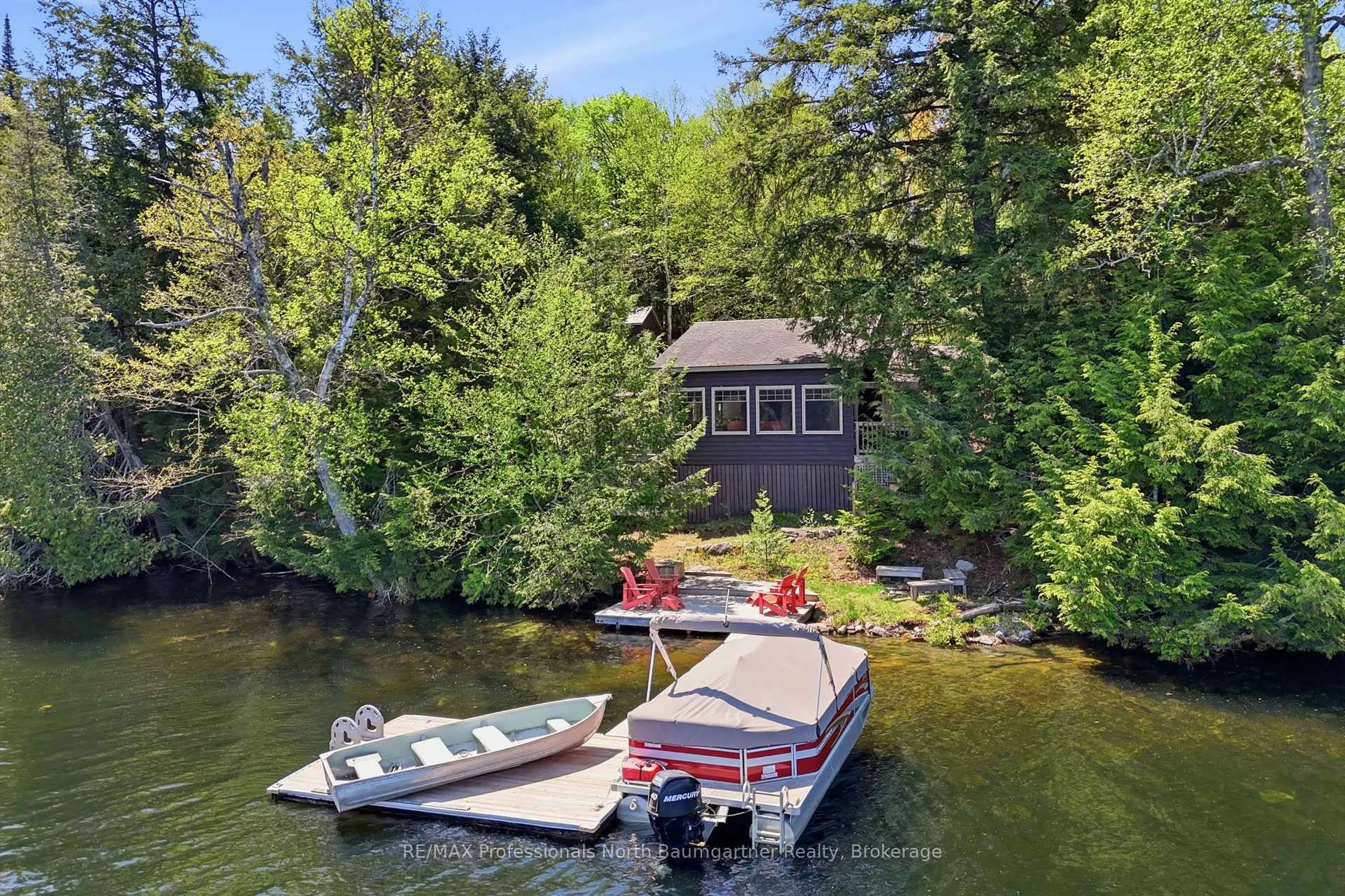 A pic from outside/outdoor area/front of a property/back of a property/a pic from drone, water/lake/river/ocean view for 2301 Sumcot Rd, Dysart et al Ontario K0L 1M1