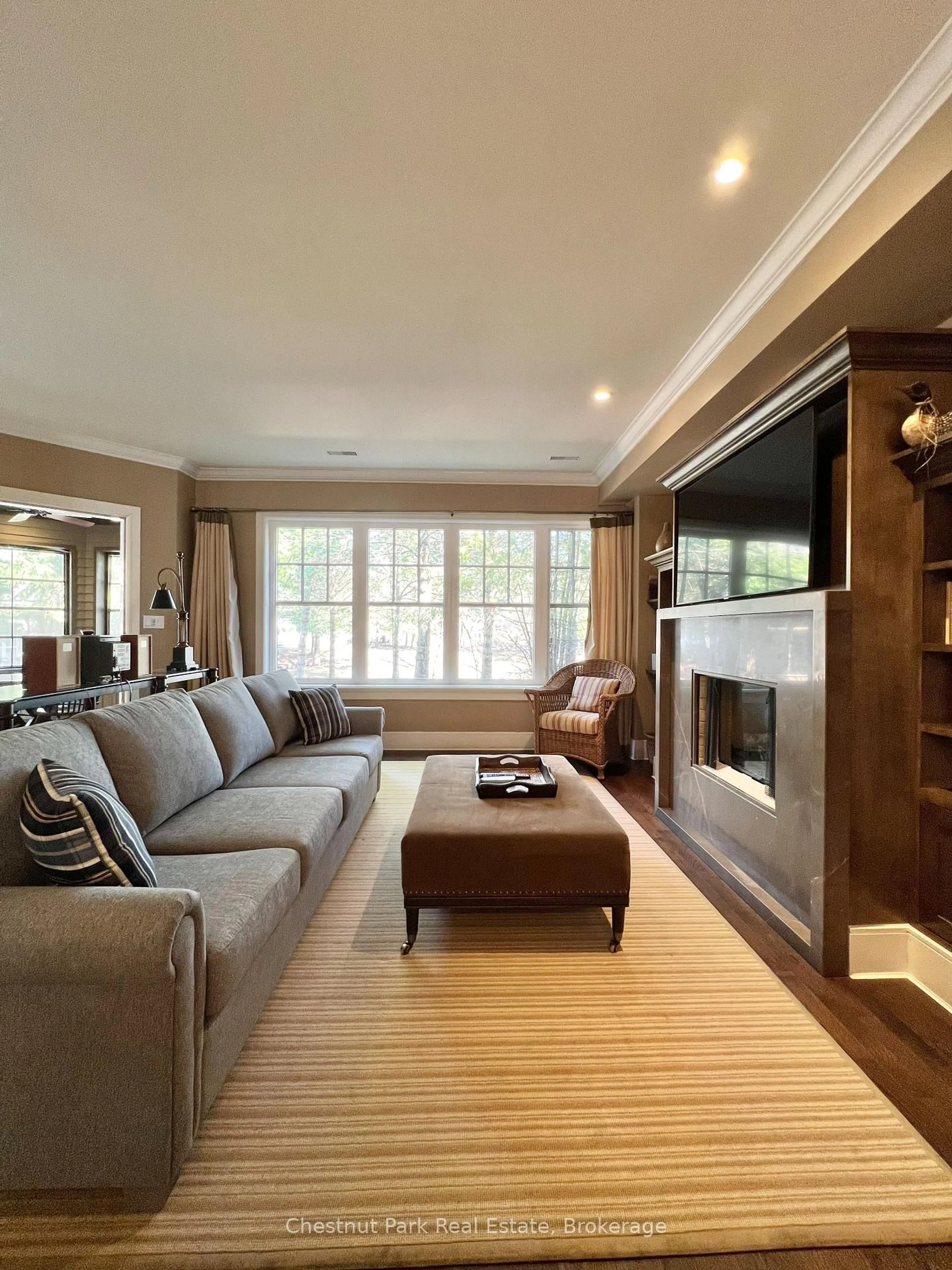 Living room with furniture, wood/laminate floor for 301 Emerald Hills Crt #Unit 11, Seguin Ontario P0C 1H0