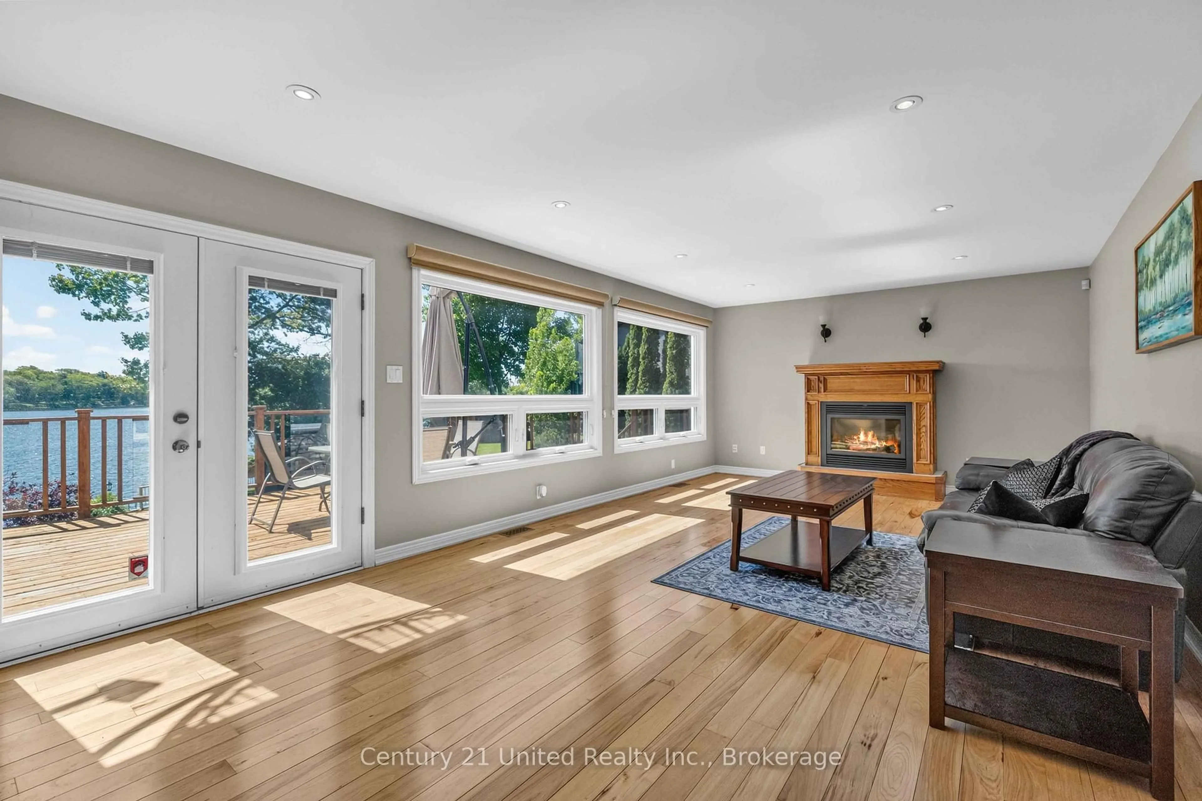 Living room with furniture, wood/laminate floor for 825 Southview Dr, Otonabee-South Monaghan Ontario K0L 1B0