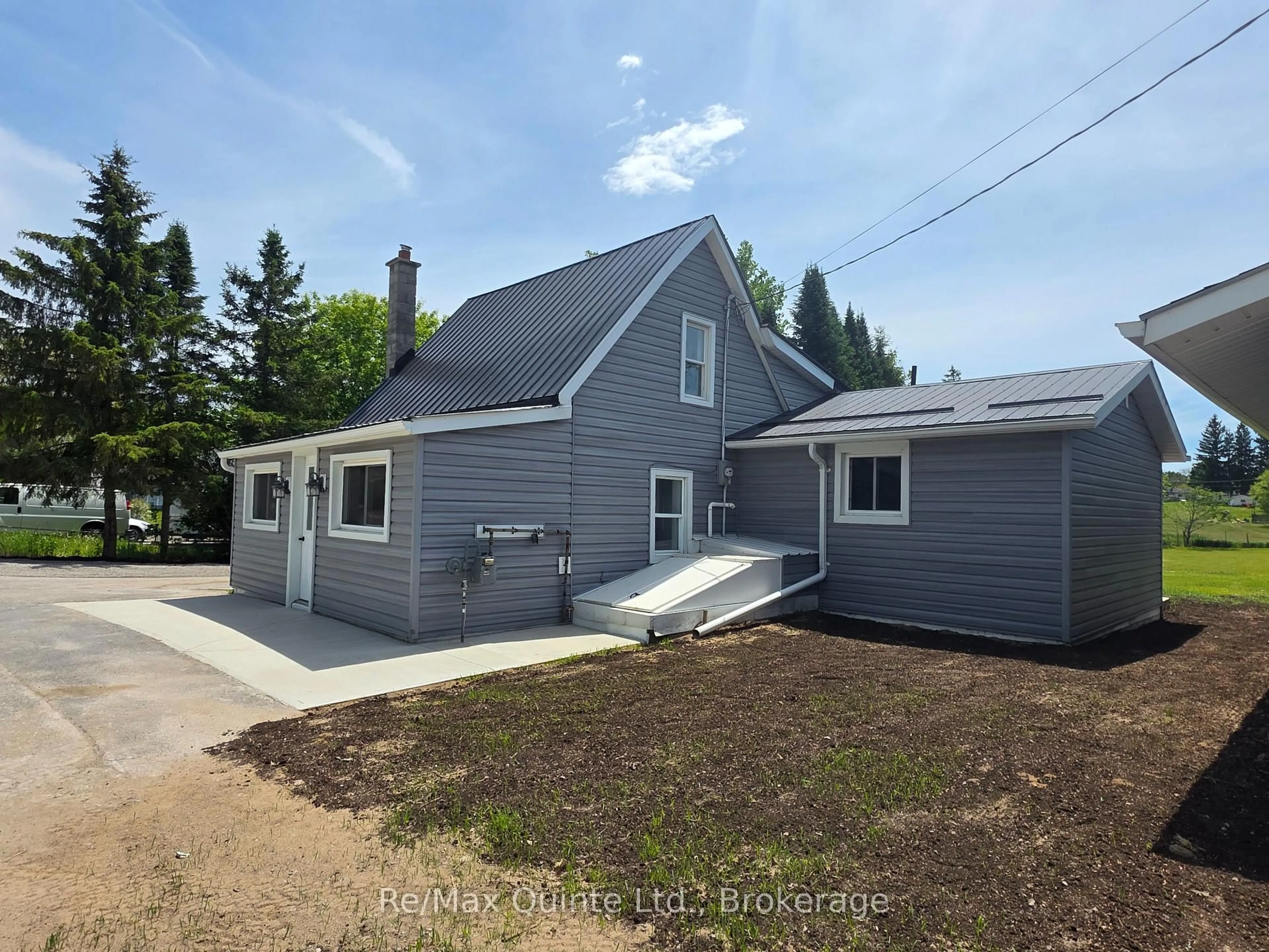 Home with vinyl exterior material, street for 61 COUNTY ROAD 1 Rd, Prince Edward County Ontario K0K 2T0