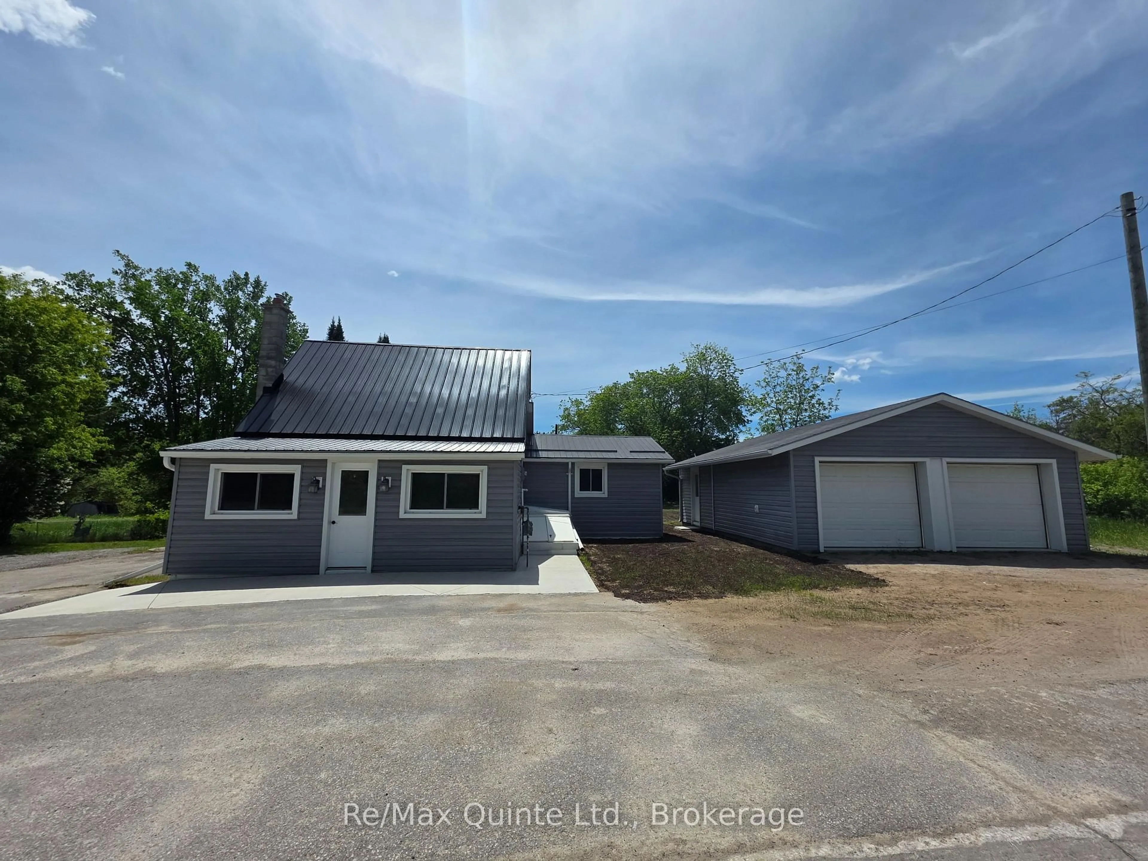 A pic from outside/outdoor area/front of a property/back of a property/a pic from drone, street for 61 COUNTY ROAD 1 Rd, Prince Edward County Ontario K0K 2T0