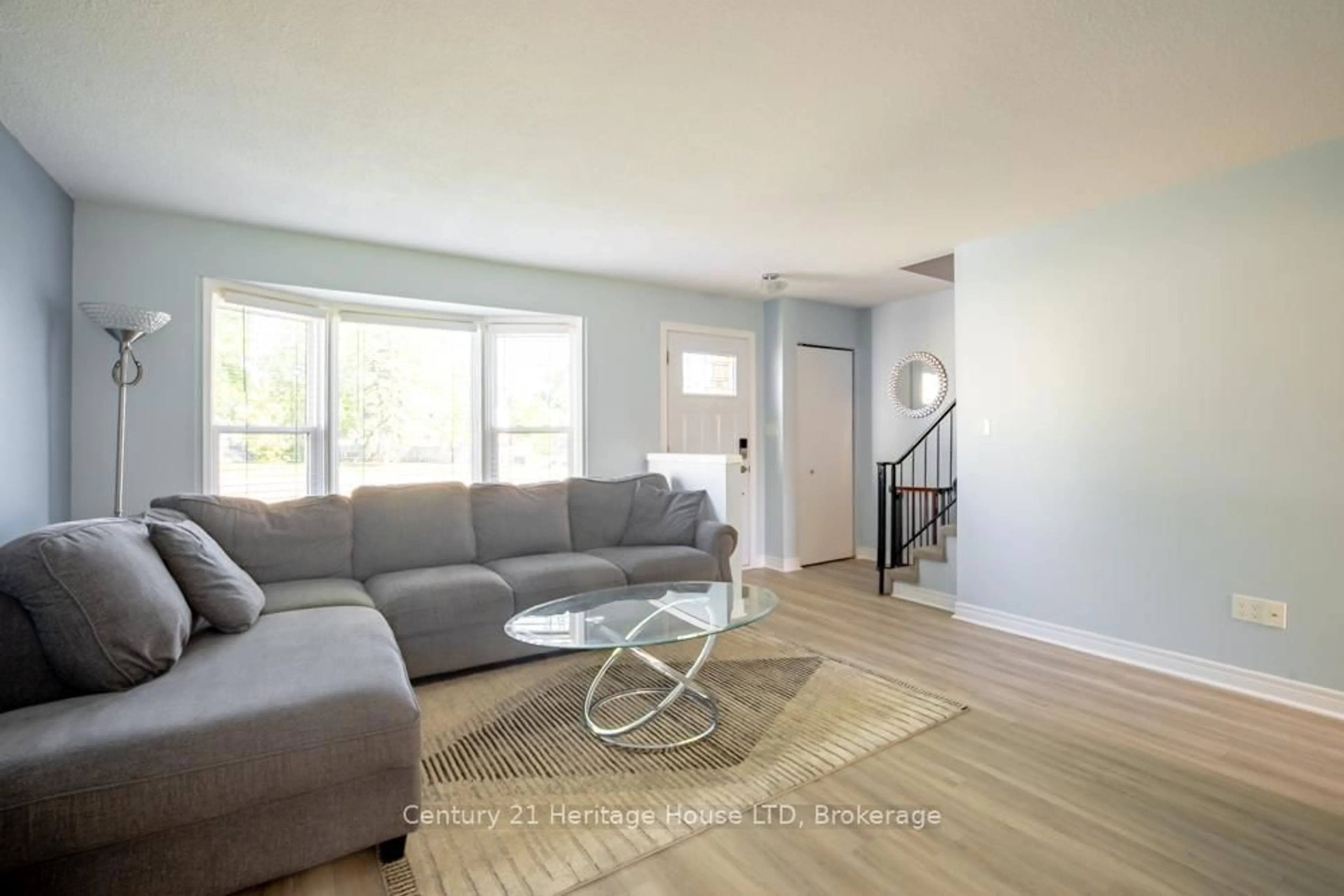 Living room with furniture, unknown for 20 Baldwin Circ, Thorold Ontario L2V 4H5