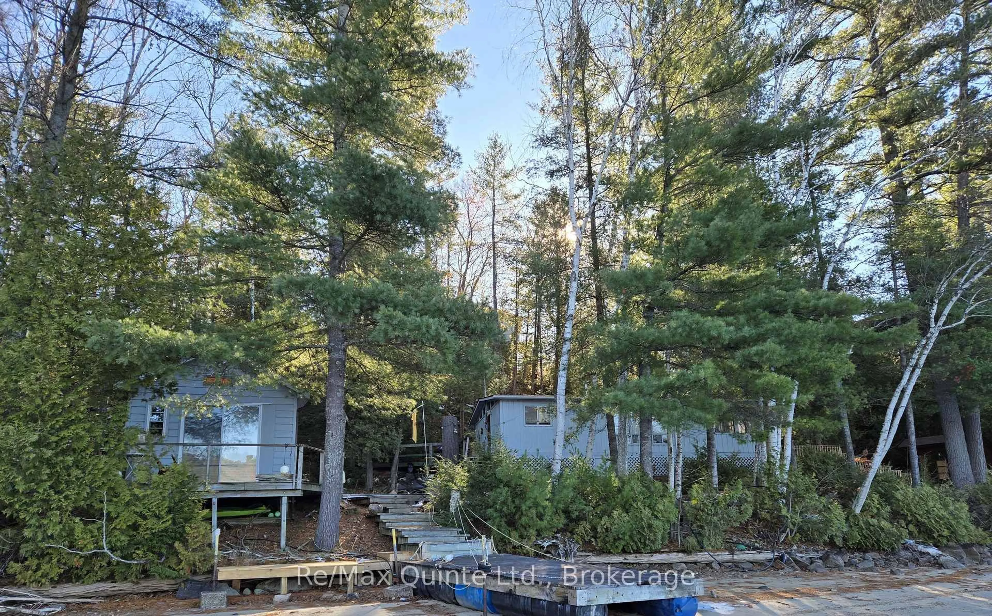 A pic from outside/outdoor area/front of a property/back of a property/a pic from drone, forest/trees view for 1261A Shawenegog Lake Lane, Cloyne Ontario K0H 1K0
