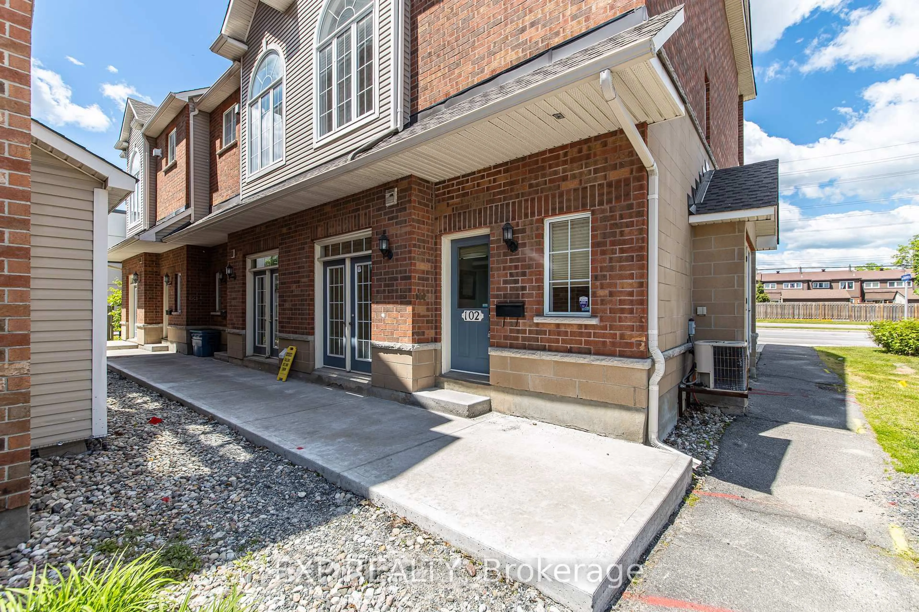 Home with brick exterior material, street for 102 Gatestone Private, Ottawa Ontario K1J 1K5