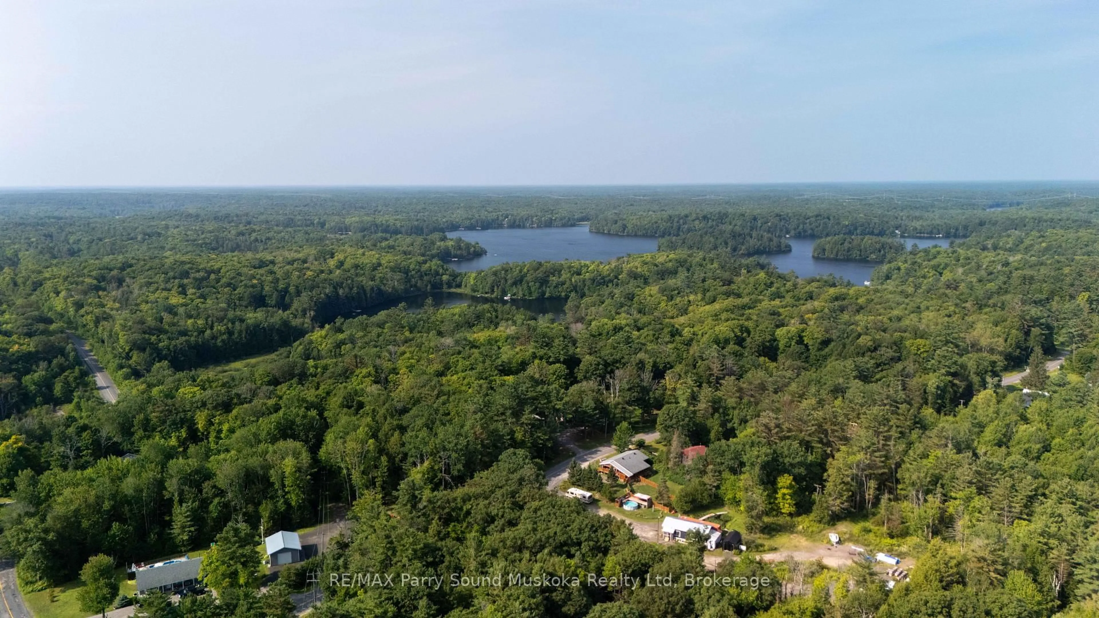 A pic from outside/outdoor area/front of a property/back of a property/a pic from drone, water/lake/river/ocean view for 288 Rankin Lake Rd, Seguin Ontario P2A 2W8