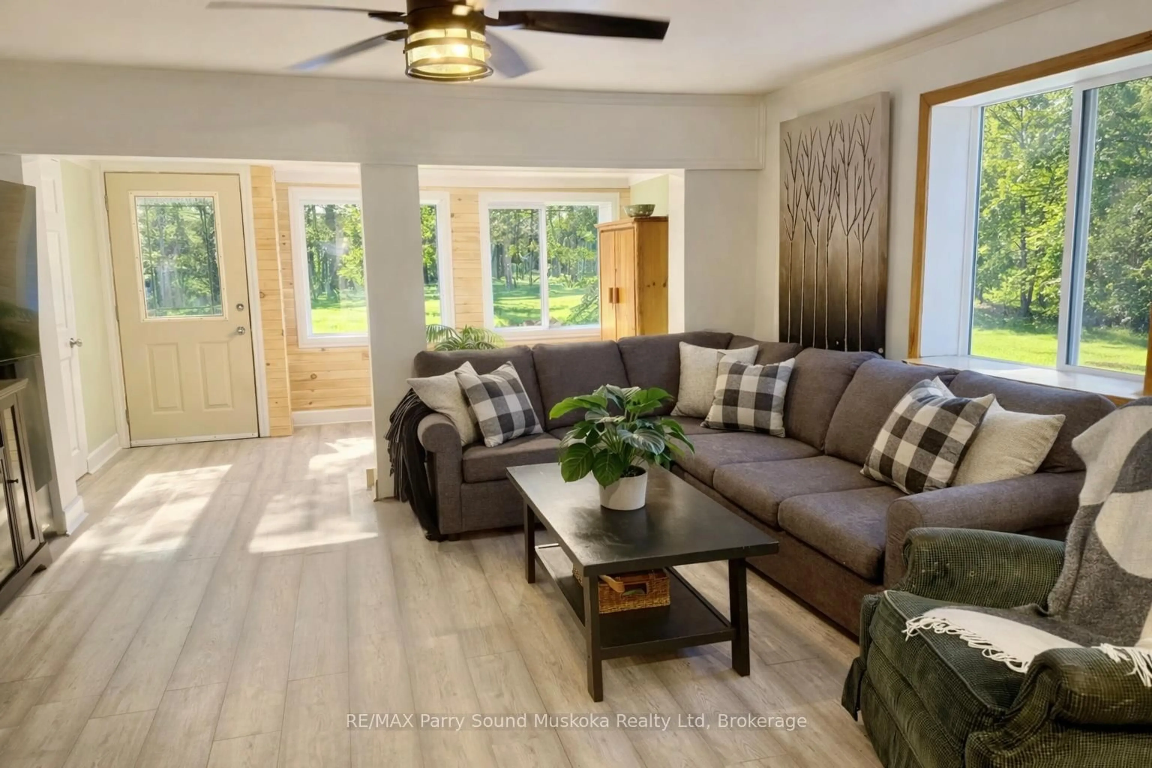 Living room with furniture, wood/laminate floor for 288 Rankin Lake Rd, Seguin Ontario P2A 2W8