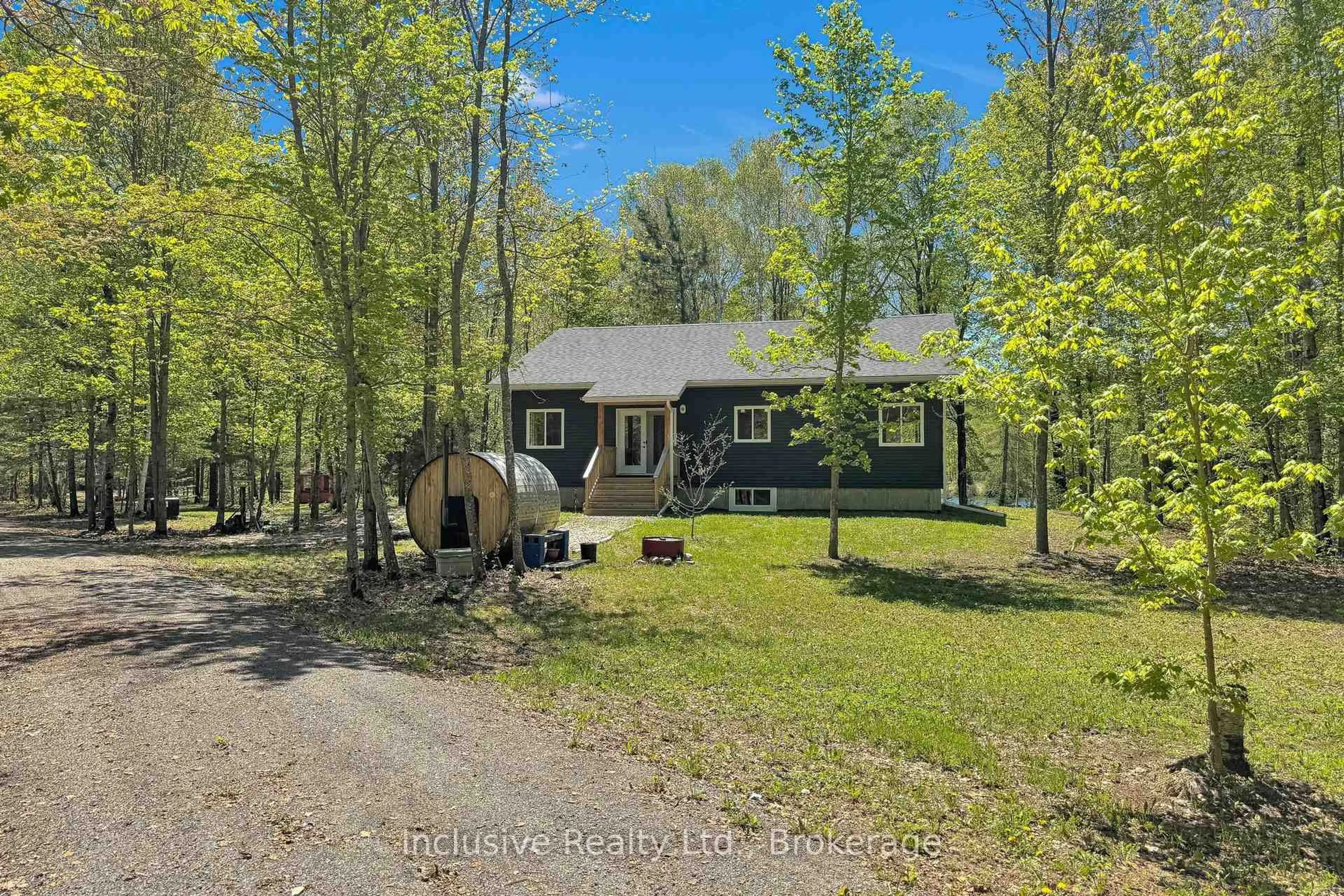 A pic from outside/outdoor area/front of a property/back of a property/a pic from drone, forest/trees view for 1269 Inlet Bay Rd, Highlands East Ontario K0L 1M0