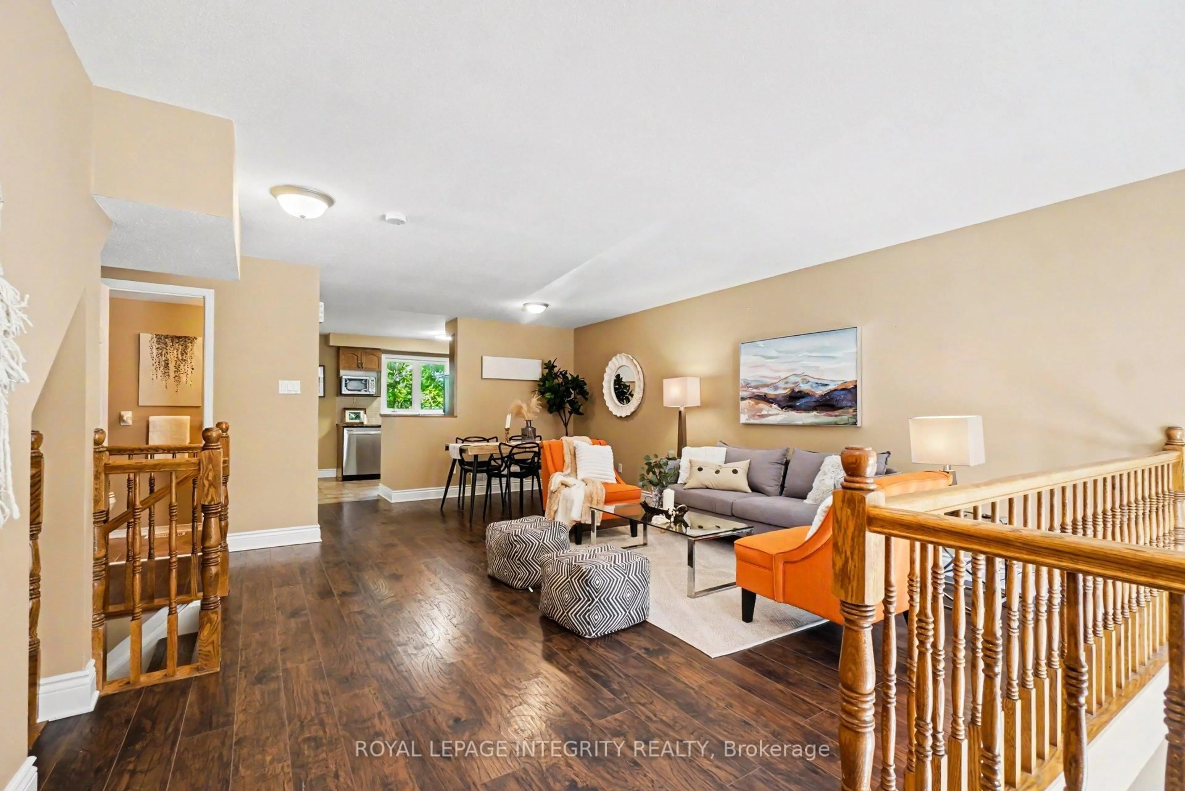 Living room with furniture, wood/laminate floor for 1512 Walkley Rd #128, Ottawa Ontario K1V 2G5