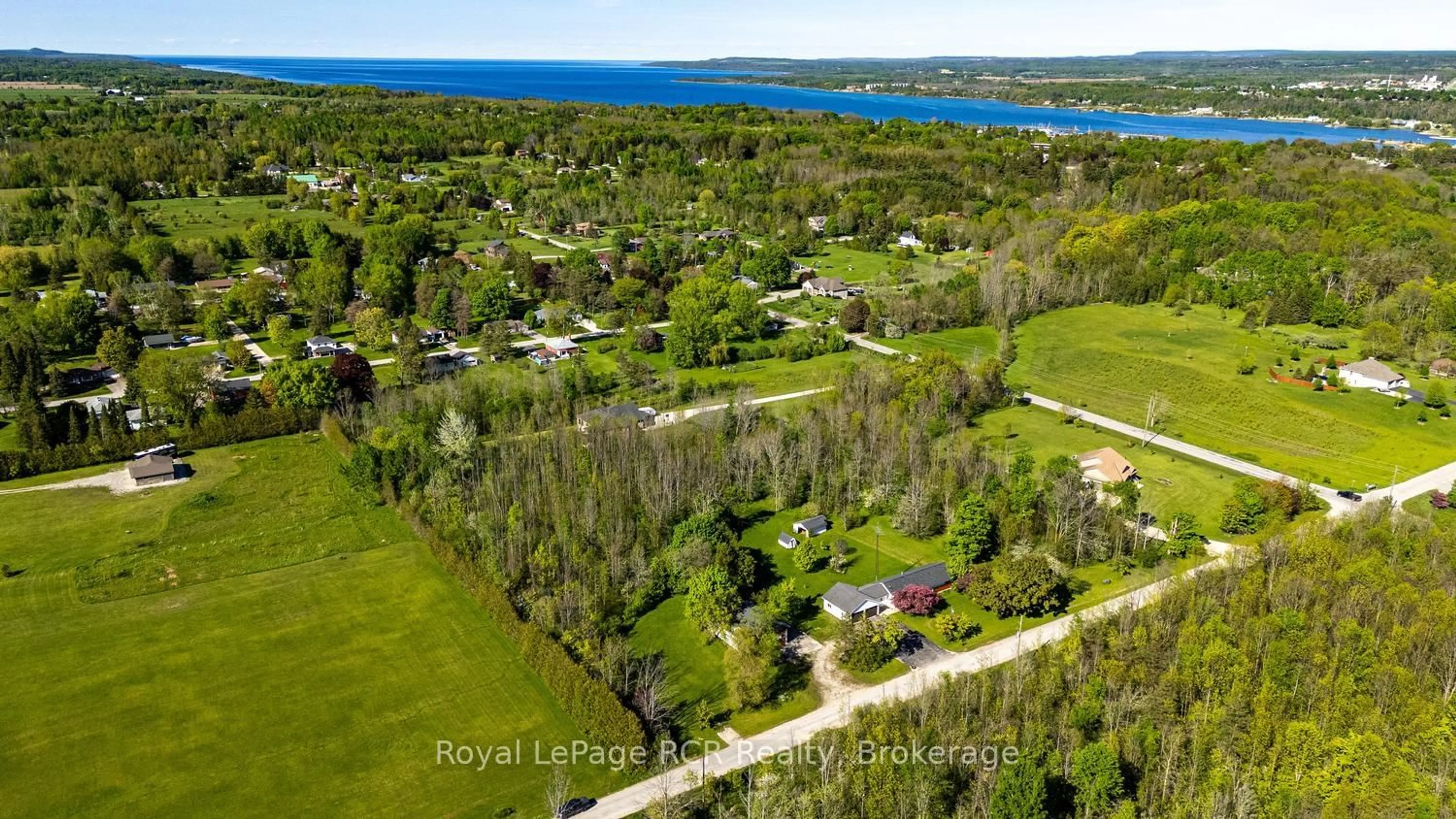 A pic from outside/outdoor area/front of a property/back of a property/a pic from drone, water/lake/river/ocean view for 873 14th St, Georgian Bluffs Ontario N4K 6V5