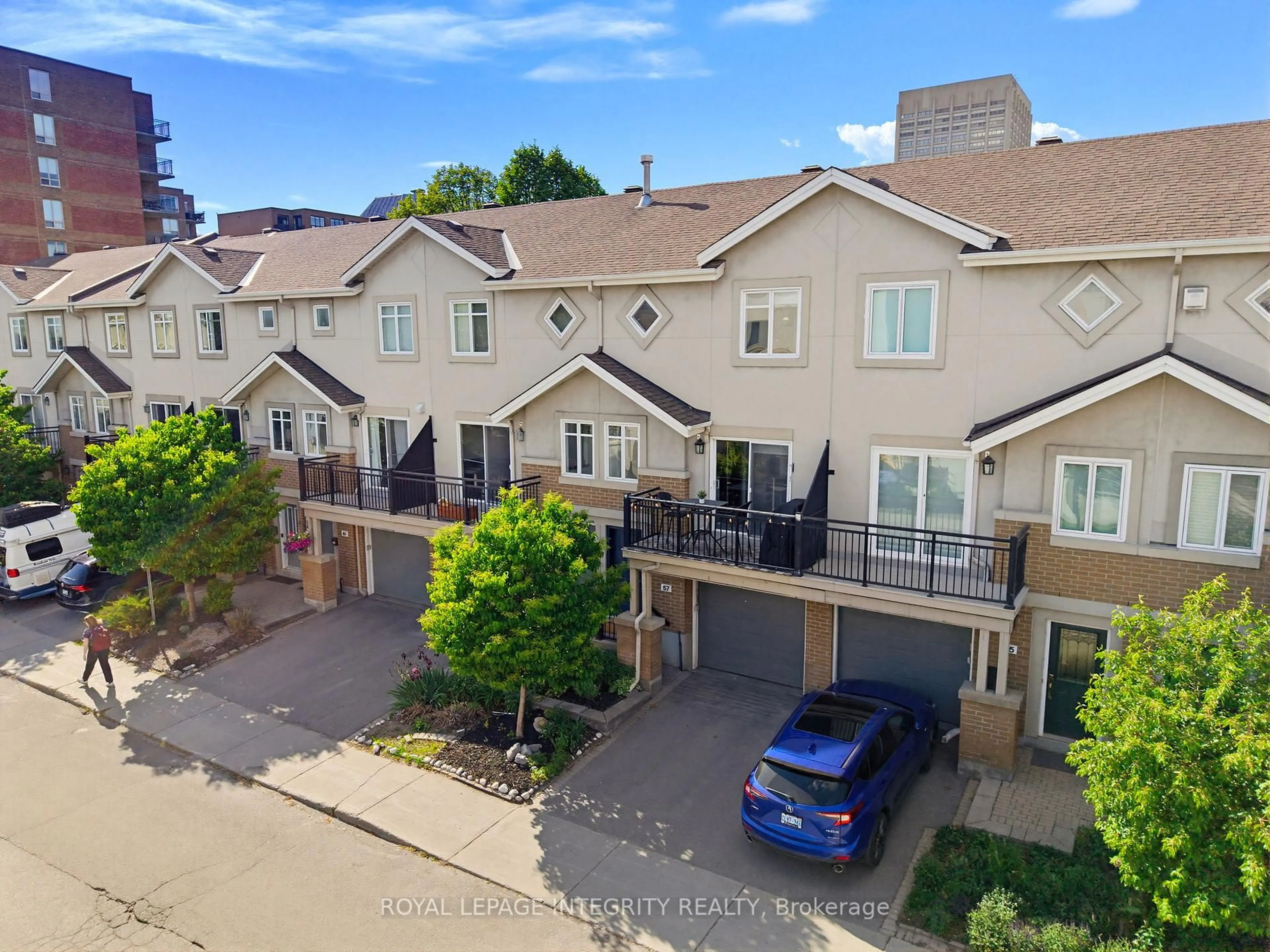 A pic from outside/outdoor area/front of a property/back of a property/a pic from drone, street for 57 Spencer St, Ottawa Ontario K1Y 4W8