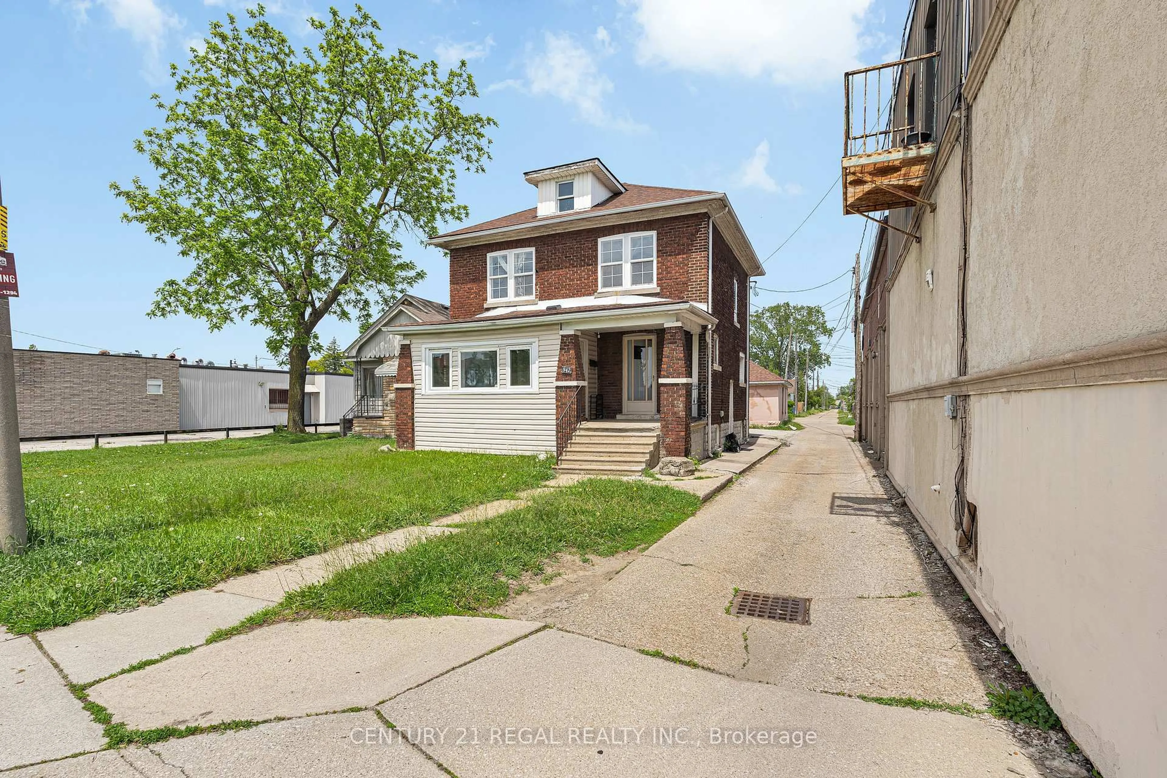 Home with brick exterior material, street for 942 Tecumseh Rd, Windsor Ontario N8X 2S6