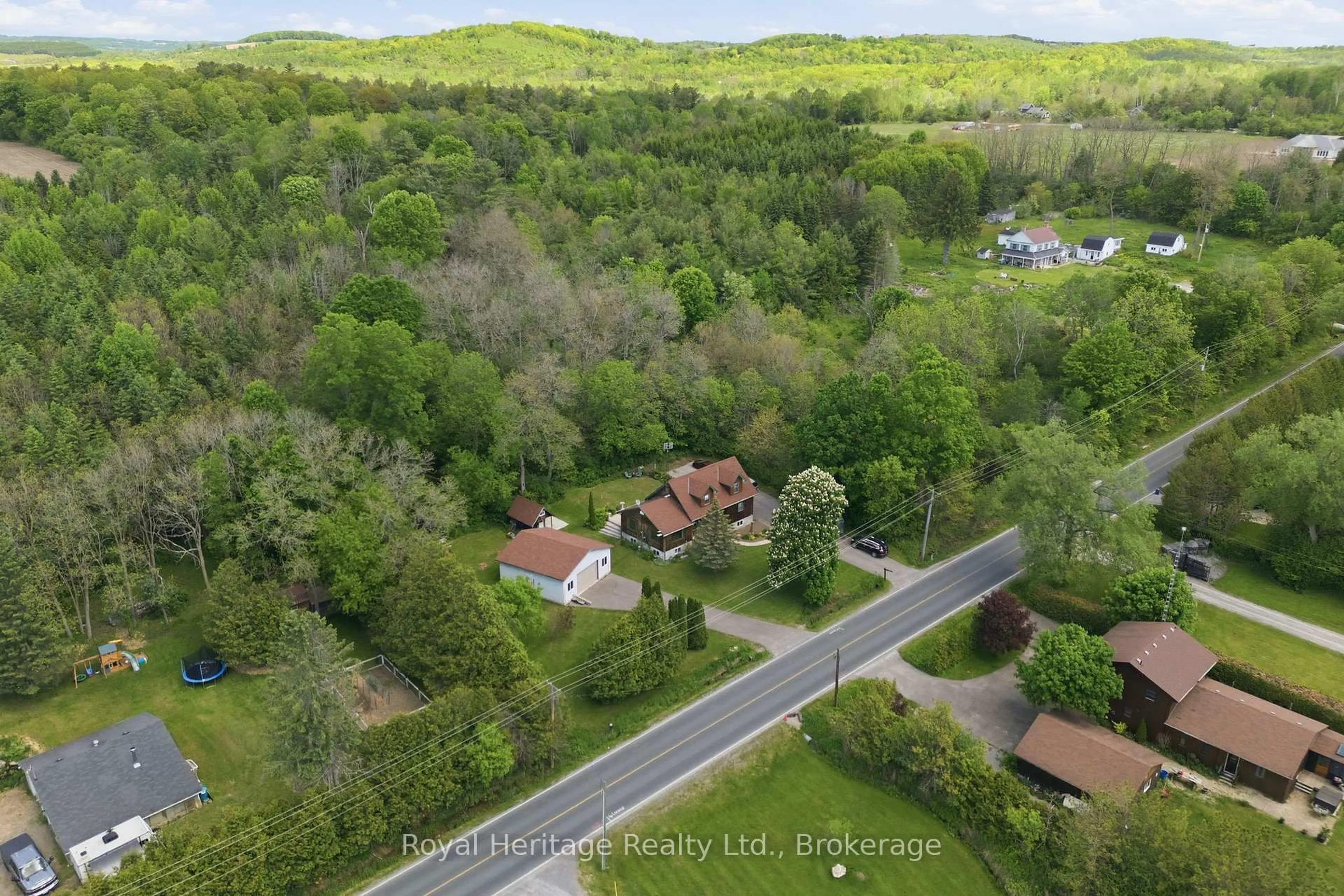 A pic from outside/outdoor area/front of a property/back of a property/a pic from drone, forest/trees view for 9312 Danforth Rd, Hamilton Township Ontario K9A 4J8