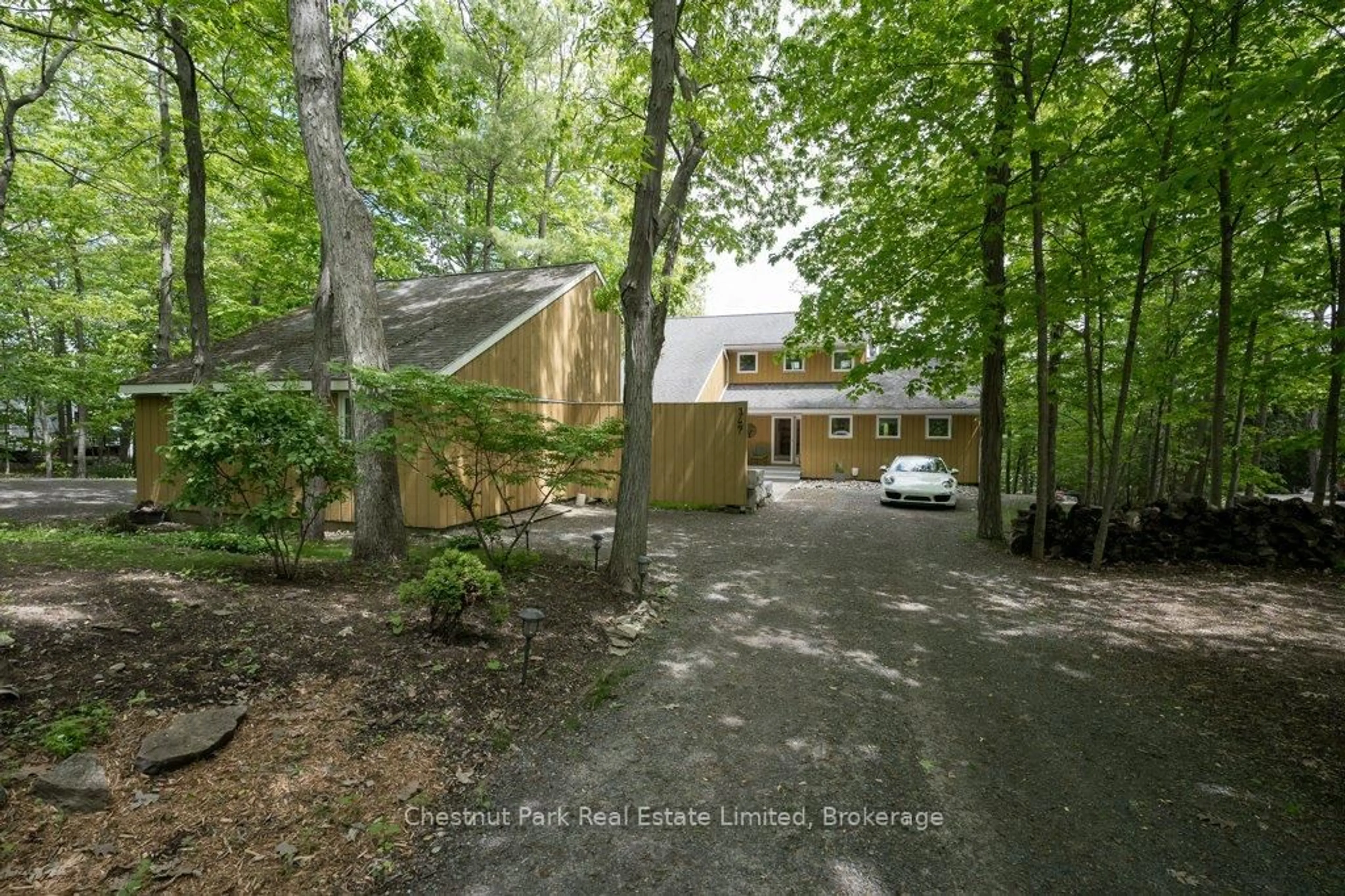 A pic from outside/outdoor area/front of a property/back of a property/a pic from drone, forest/trees view for 347 Prinyers Cove Cres, Prince Edward County Ontario K0K 2T0