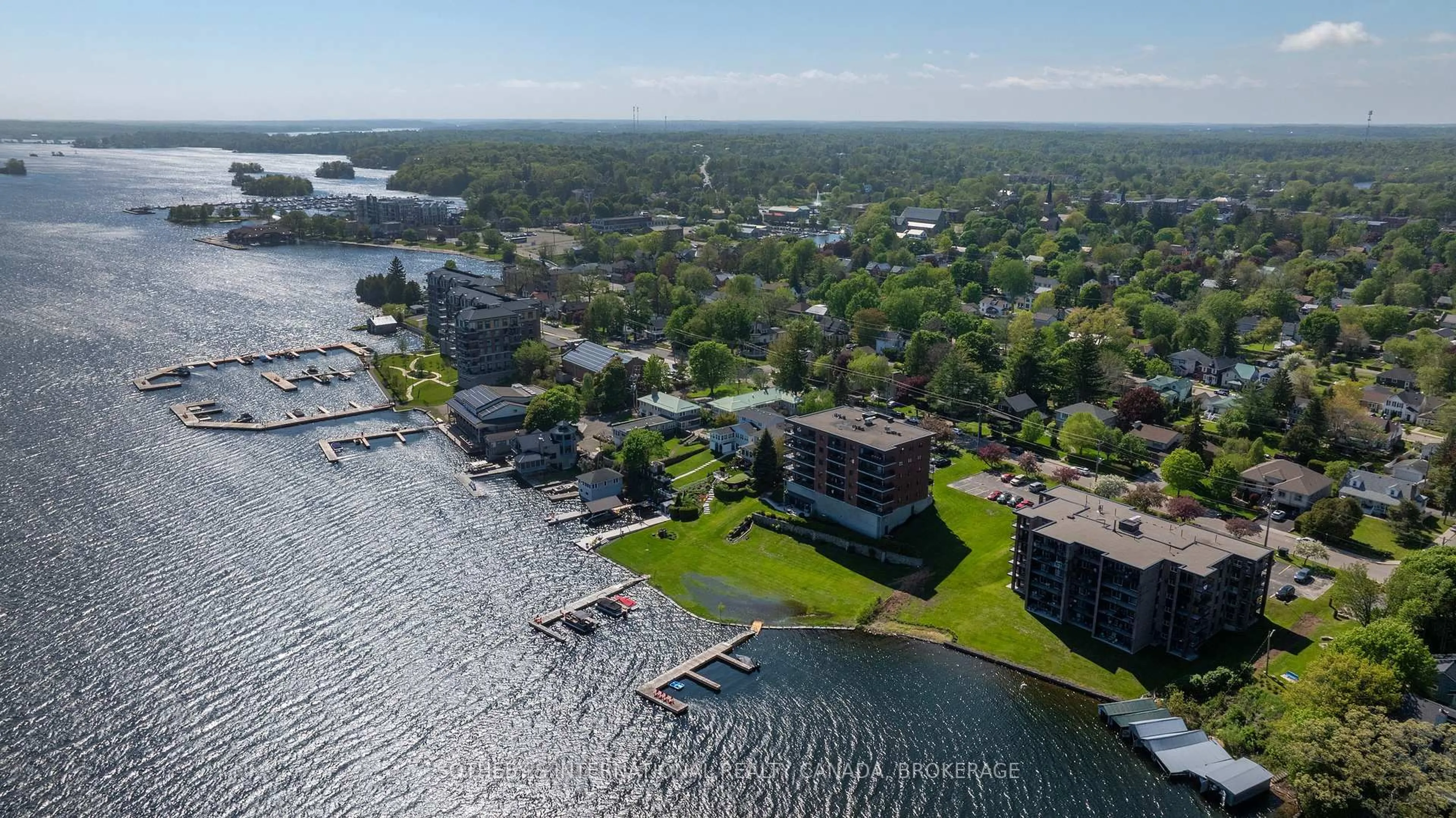 A pic from outside/outdoor area/front of a property/back of a property/a pic from drone, water/lake/river/ocean view for 235 South St #302, Gananoque Ontario K7G 1A4