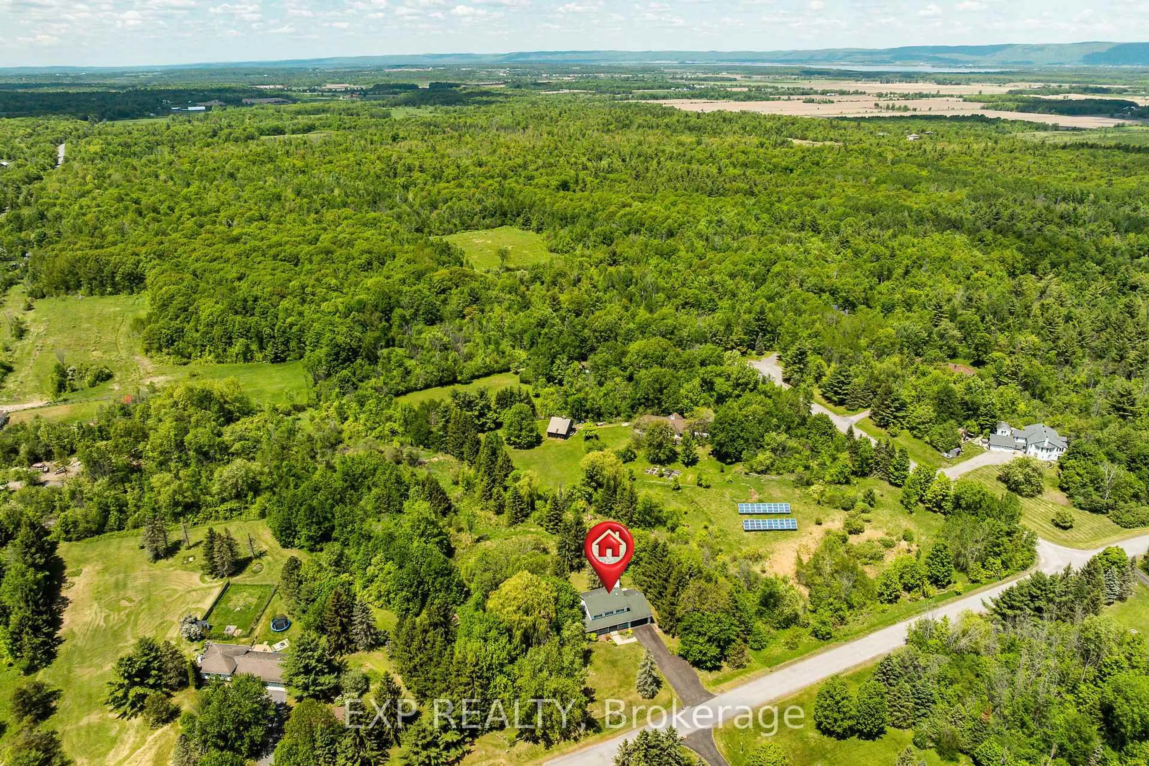 A pic from outside/outdoor area/front of a property/back of a property/a pic from drone, forest/trees view for 105 Kilkenny Dr, Ottawa Ontario K0A 1T0