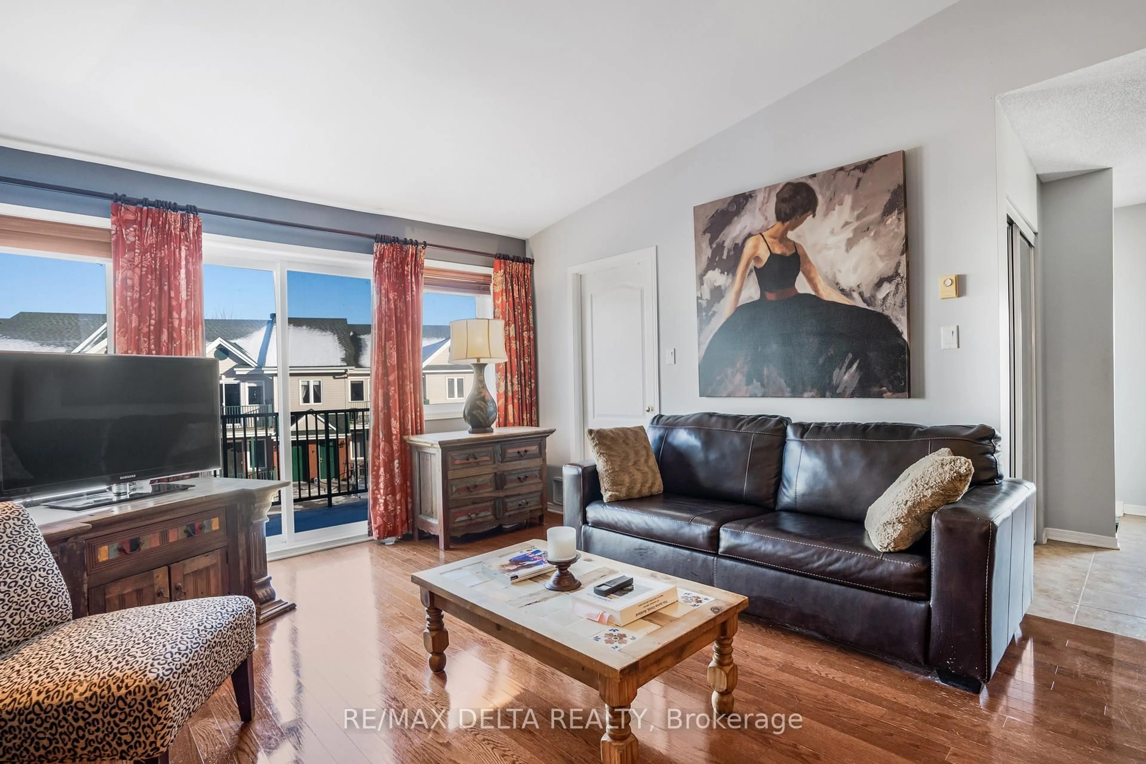 Living room with furniture, wood/laminate floor for 2927 Laurier St #208, Clarence-Rockland Ontario K4K 1T8