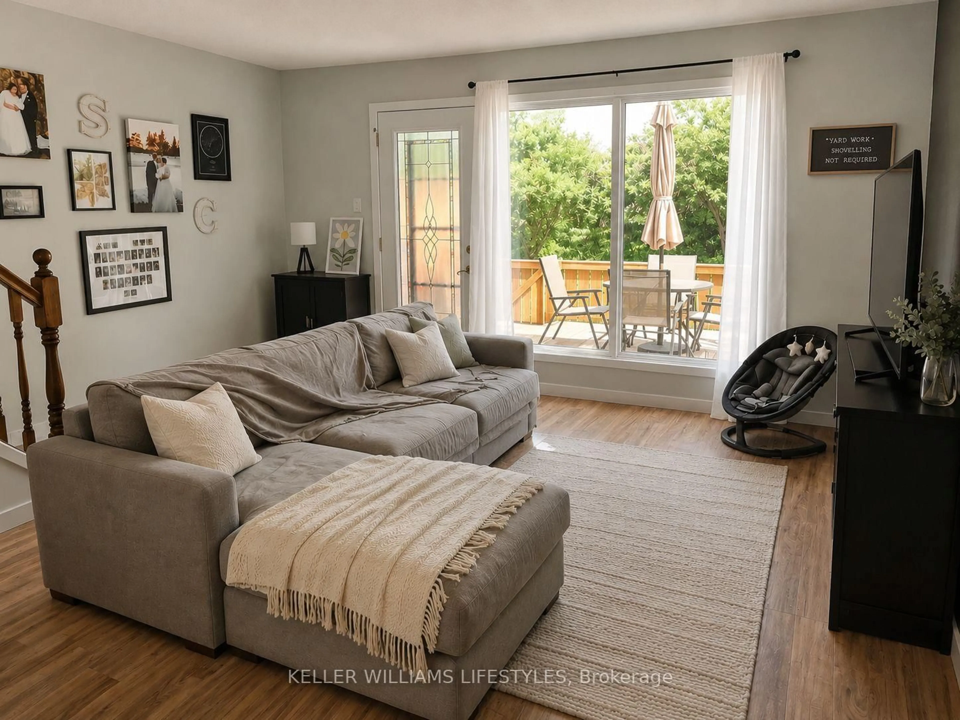 Living room with furniture, wood/laminate floor for 664 Wonderland Rd, London South Ontario N6K 1L8