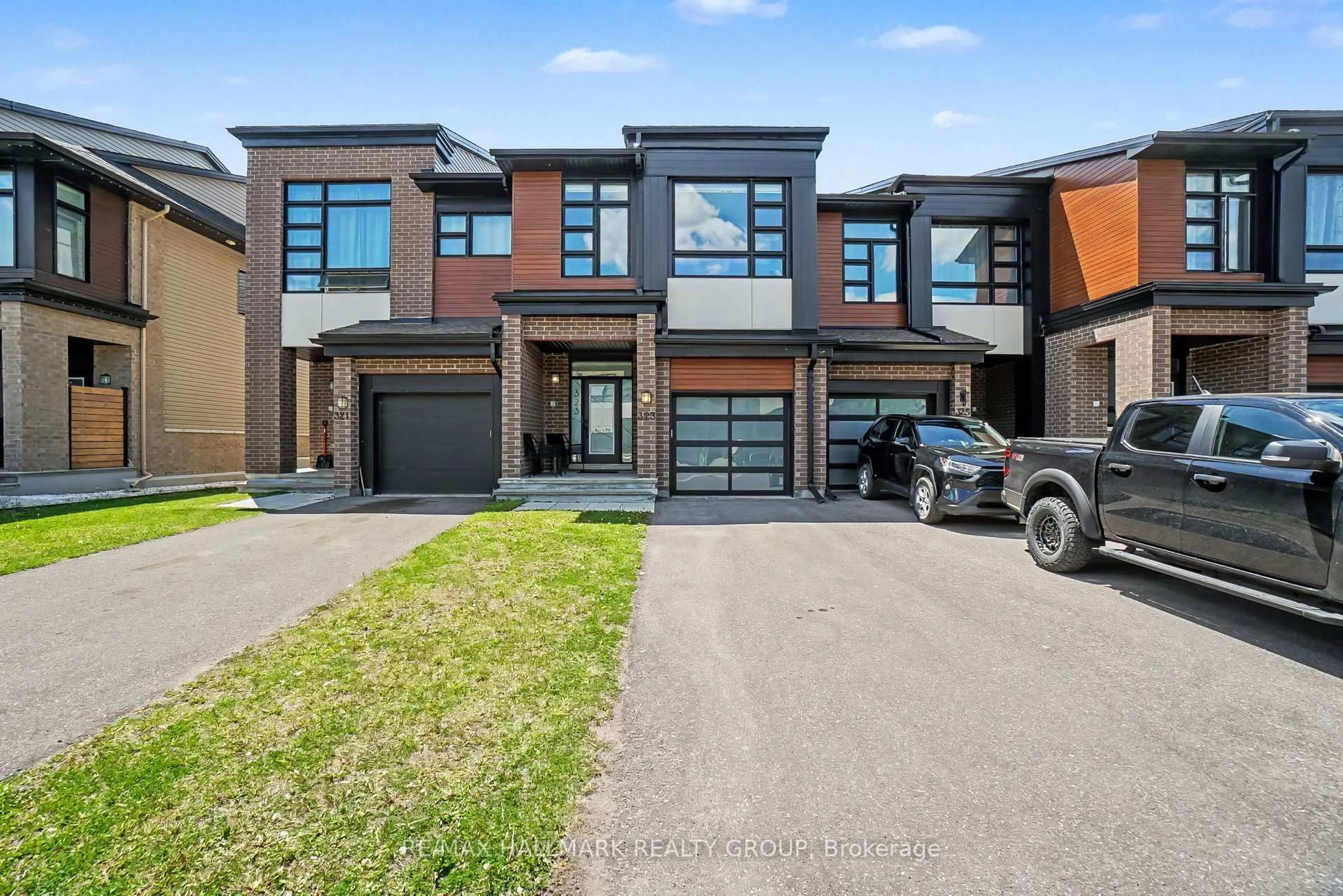 Home with brick exterior material, street for 323 Wabasso Lane, Ottawa Ontario K1T 0T2