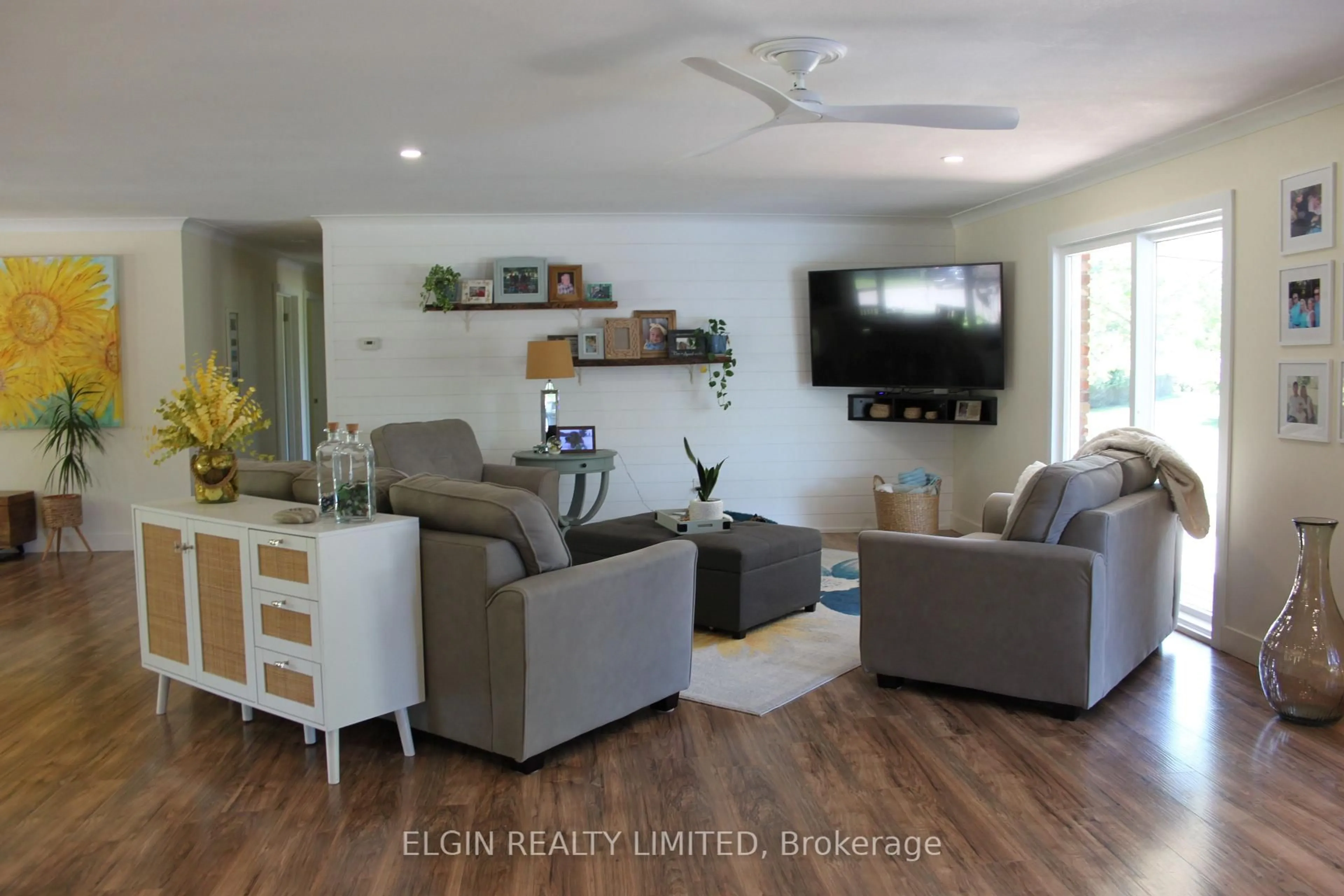 Living room with furniture, wood/laminate floor for 42445 John Wise Line, Central Elgin Ontario N5R 5T4