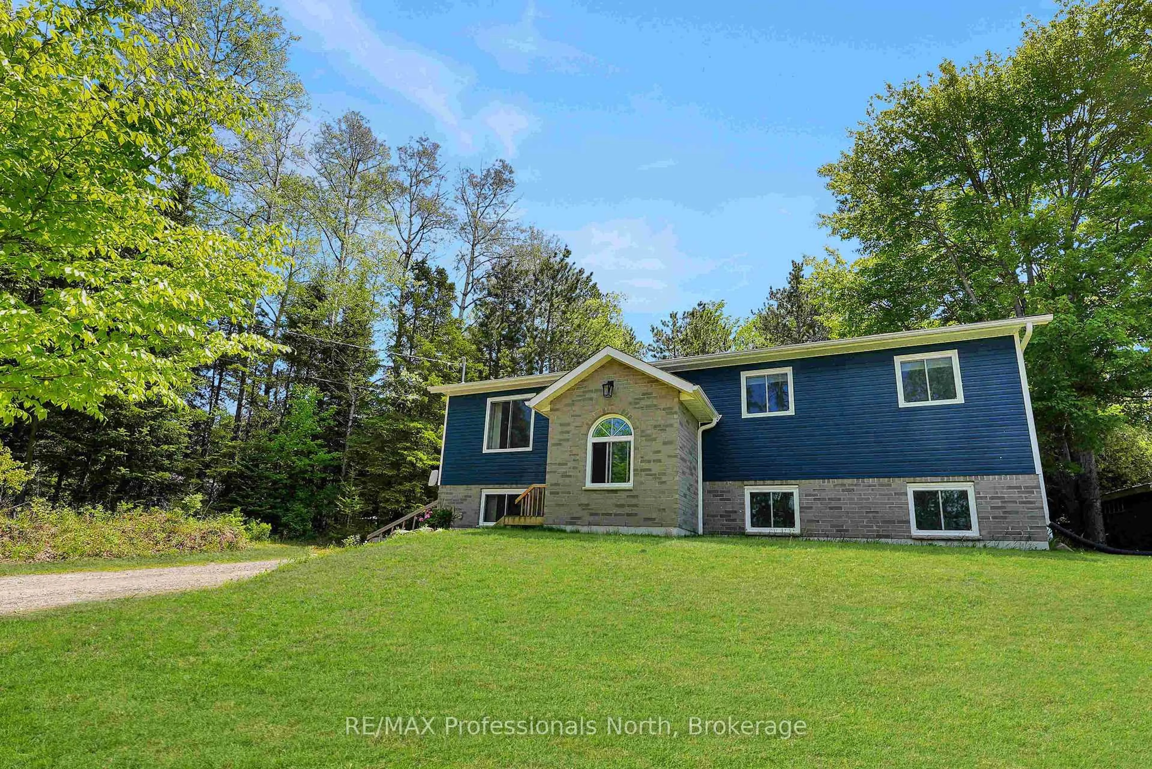 A pic from outside/outdoor area/front of a property/back of a property/a pic from drone, water/lake/river/ocean view for 4342 County Road 21, Dysart et al Ontario K0M 1S0