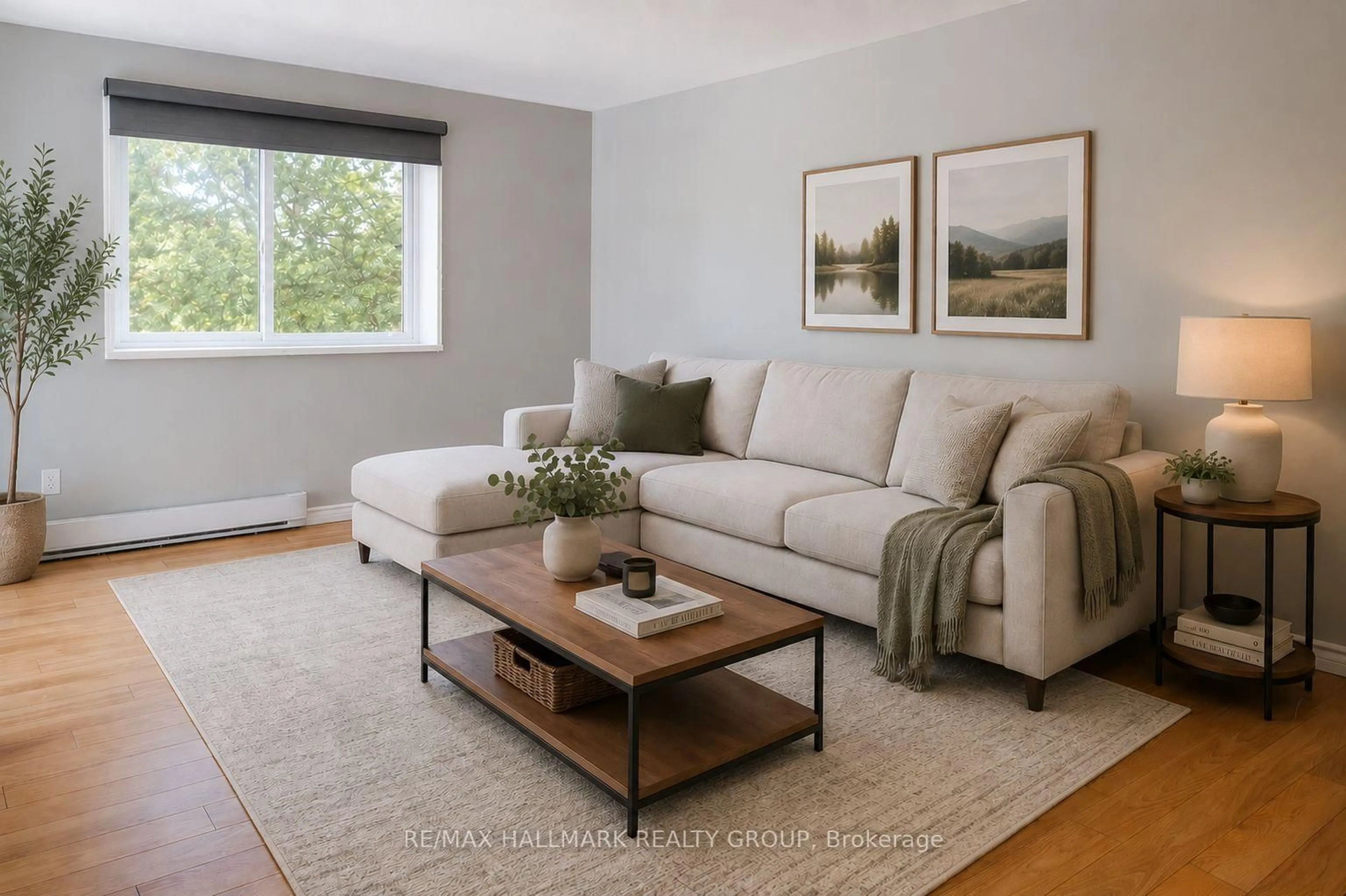 Living room with furniture, wood/laminate floor for 280 Brittany Dr #406, Ottawa Ontario K1K 4M4