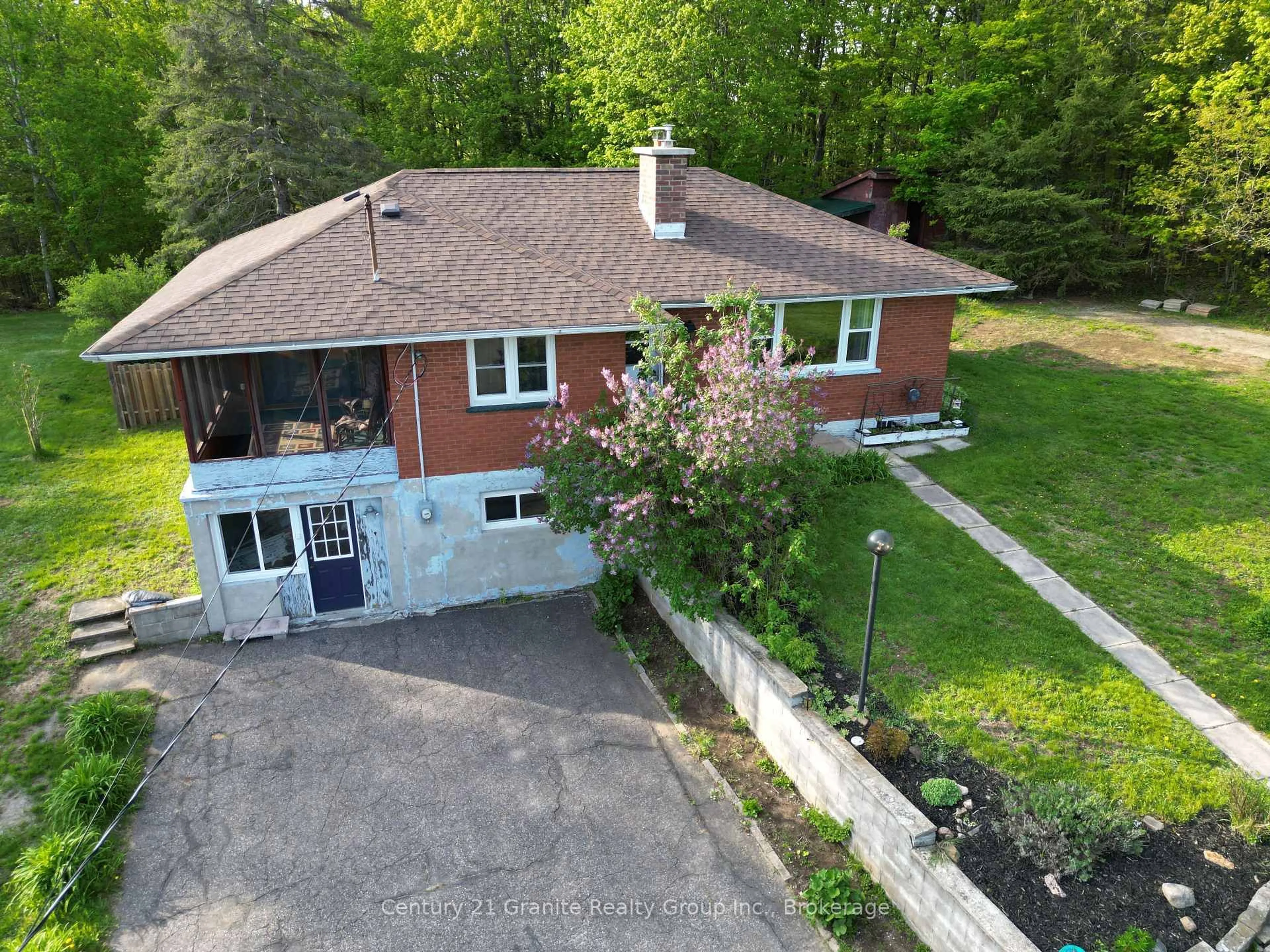A pic from outside/outdoor area/front of a property/back of a property/a pic from drone, street for 1523 County Road 21 Rd, Minden Hills Ontario K0M 2K0