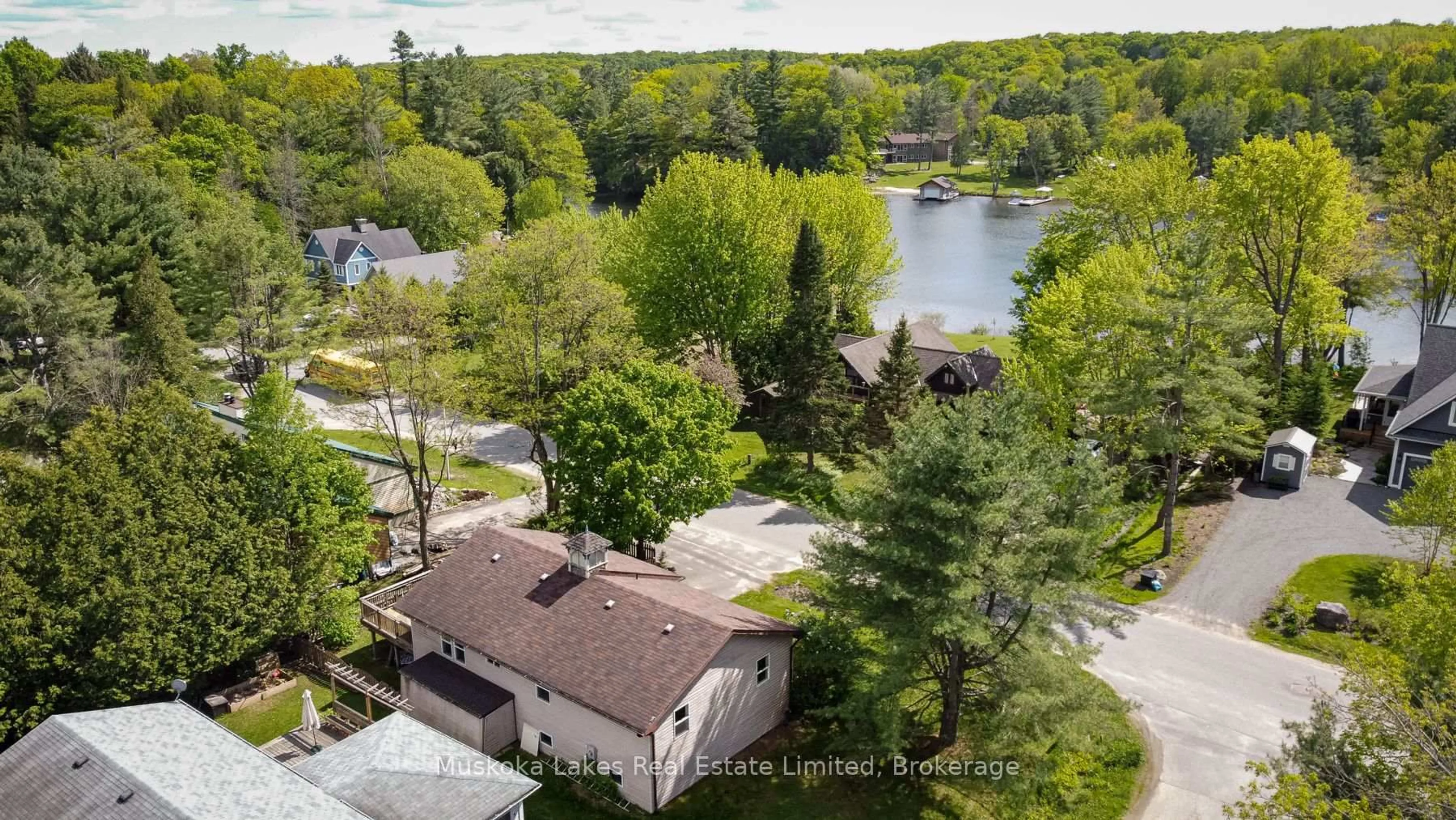 A pic from outside/outdoor area/front of a property/back of a property/a pic from drone, water/lake/river/ocean view for 11 Harris St, Muskoka Lakes Ontario P0B 1J0
