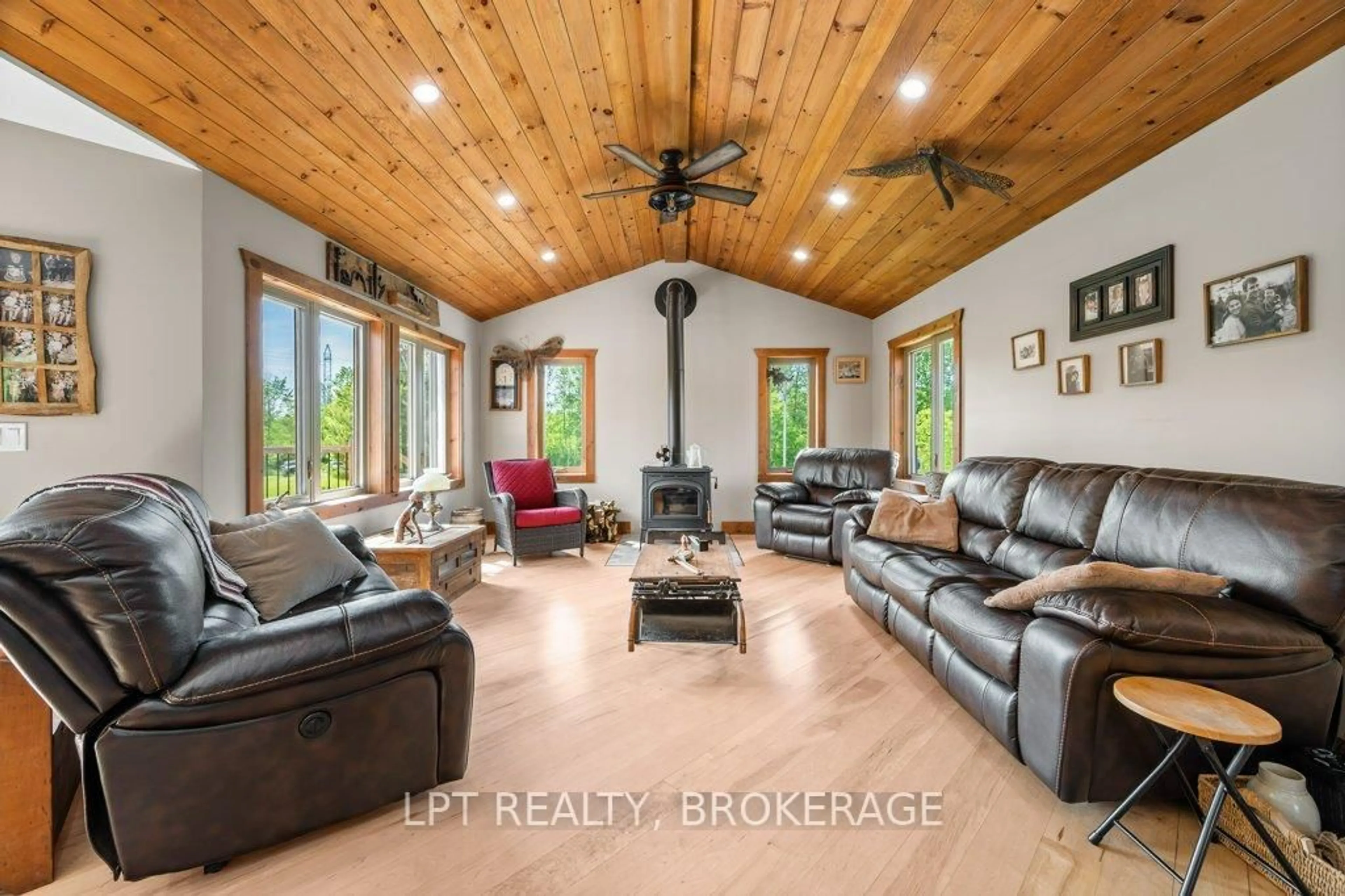Living room with furniture, wood/laminate floor for 1718 Forty Foot Rd, Godfrey Ontario K0H 1T0