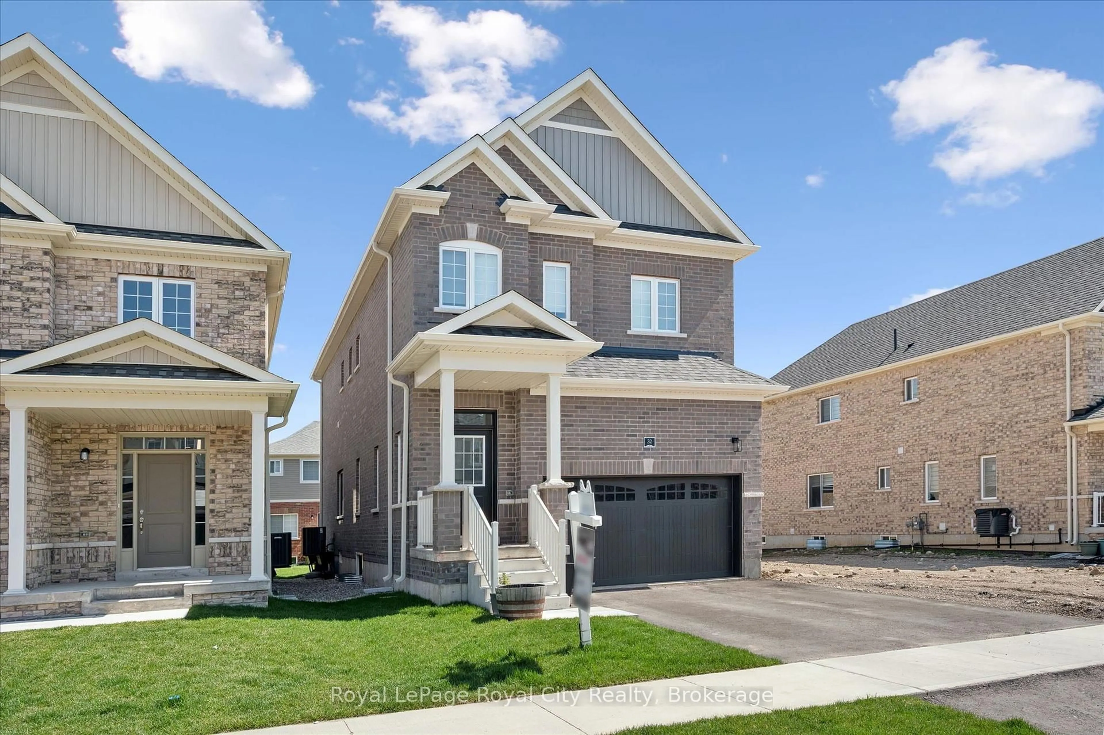 Home with brick exterior material, street for 32 Hutchison Rd, Guelph Ontario N1L 0R4