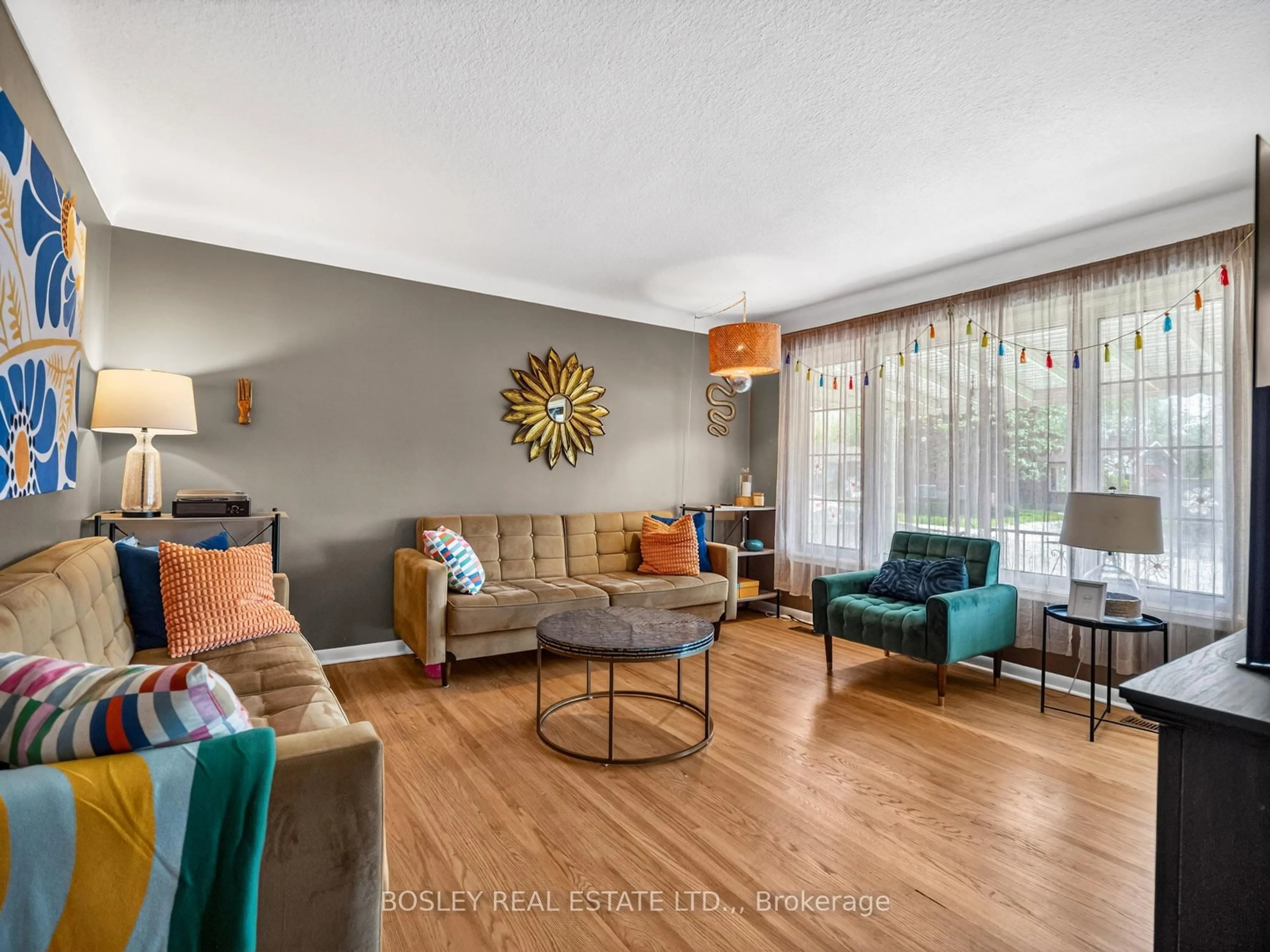 Living room with furniture, wood/laminate floor for 6521 Caledonia St, Niagara Falls Ontario L2G 5A6