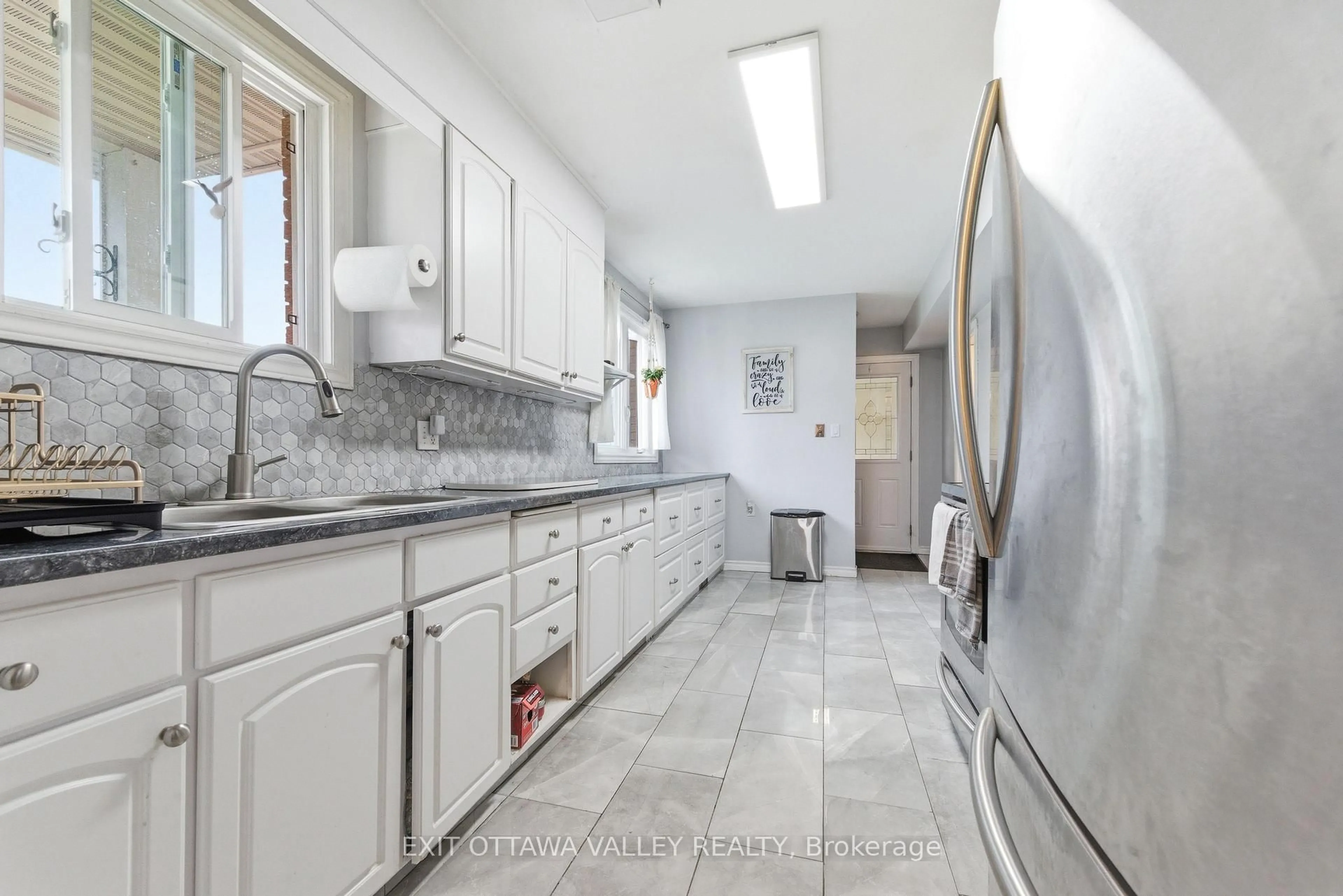 Kitchen with laundary machines, ceramic/tile floor for 13 Tamarack St, Deep River Ontario K0J 1P0