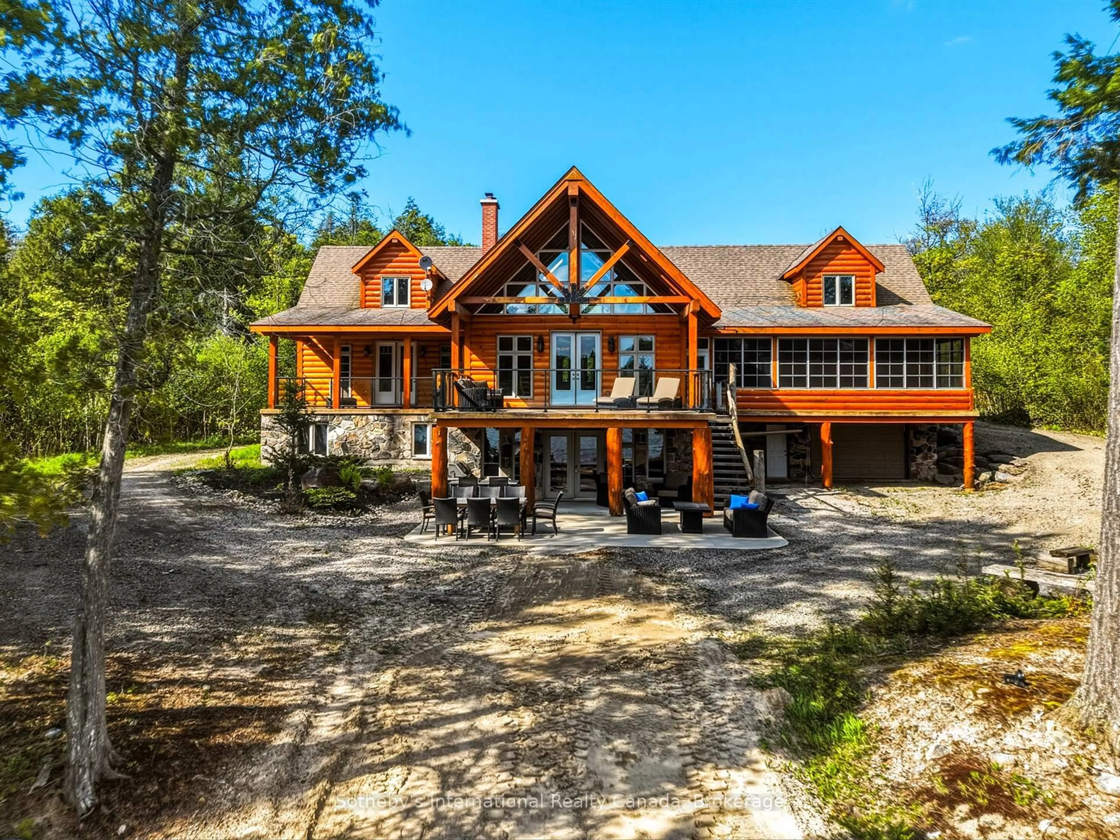A pic from outside/outdoor area/front of a property/back of a property/a pic from drone, water/lake/river/ocean view for 2889 Ahmic Lake Rd, Magnetawan Ontario P0A 1P0