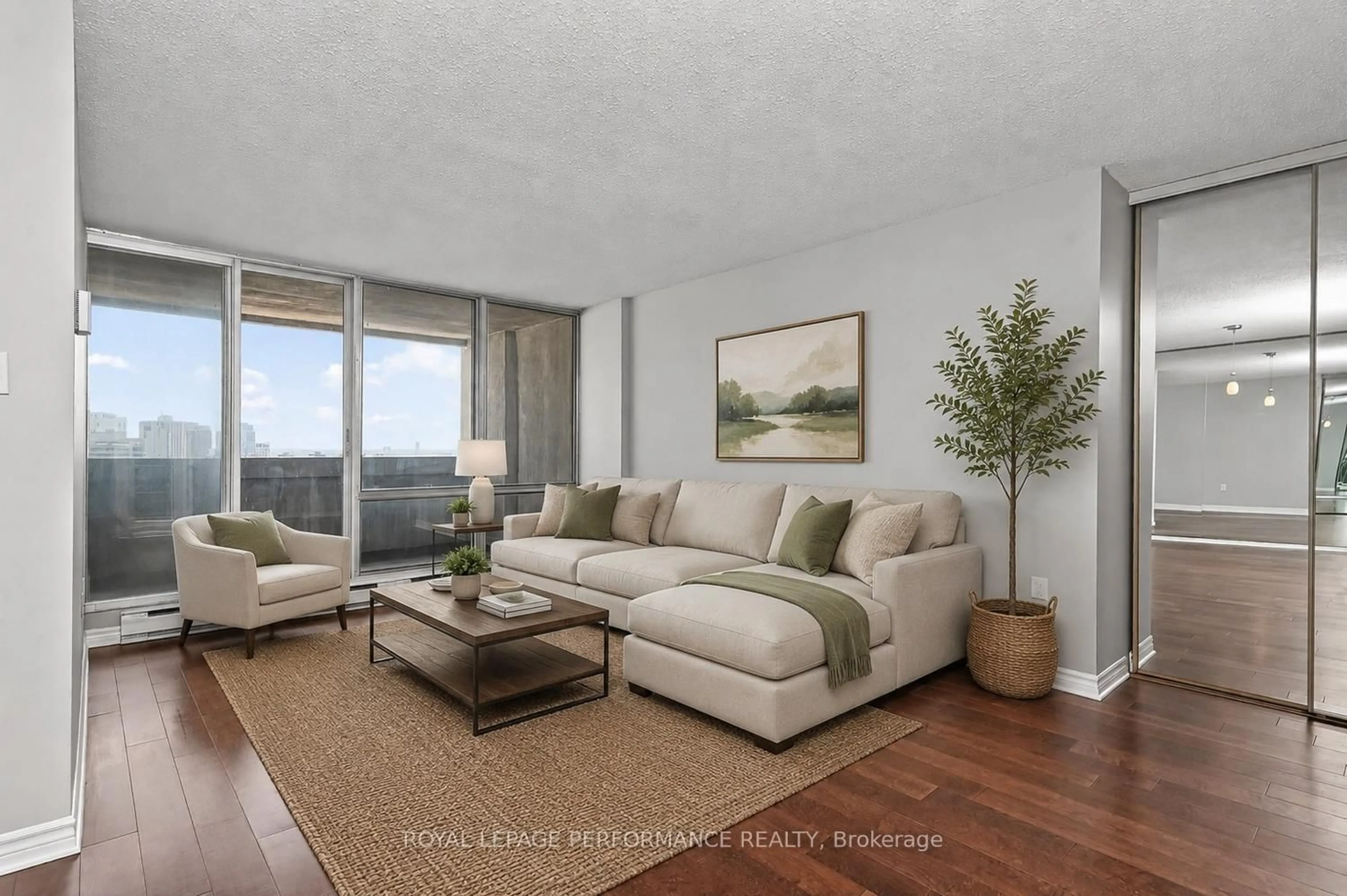 Living room with furniture, wood/laminate floor for 530 Laurier Ave #2502, Ottawa Ontario K1R 7T1